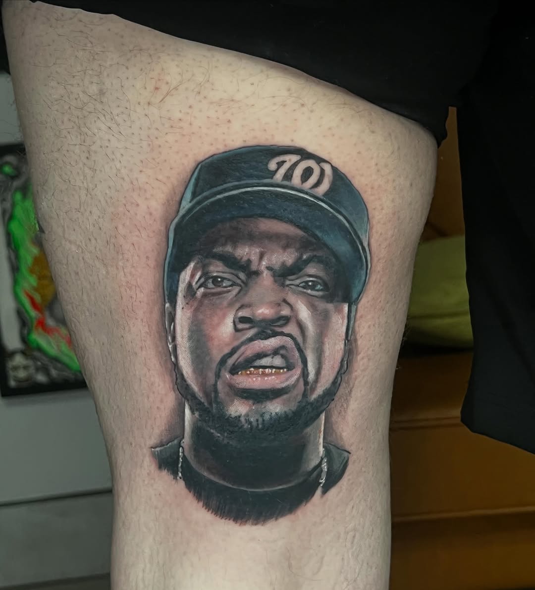 Ice Cube portrait realism tattoo on the thigh by Levi Cox, Powell, Ohio