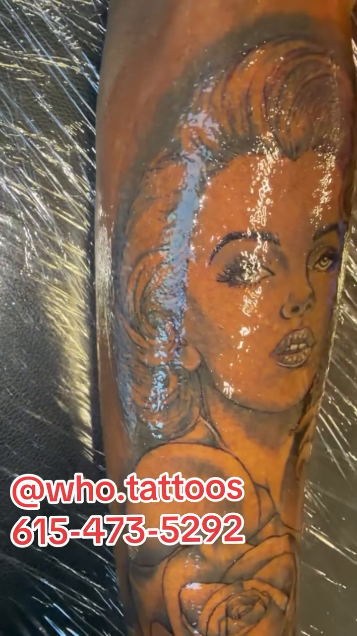 Marilyn Monroe portrait with roses realism tattoo on the forearm by Marcus Carter