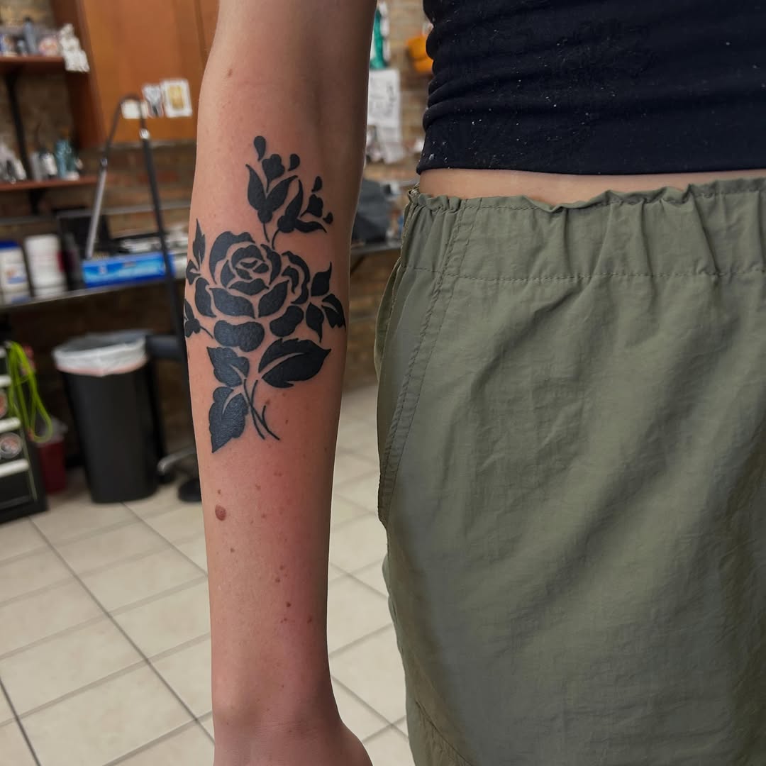 Rose and buds neo-traditional tattoo on the forearm by Elizabeth Niederkorn