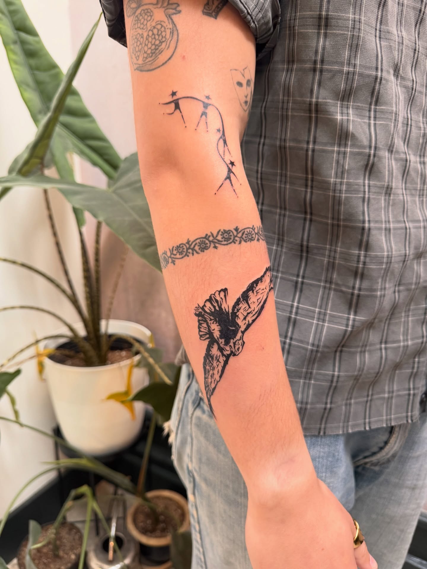 Whale tail and floral band black and grey tattoo on the forearm by Sam Padilla