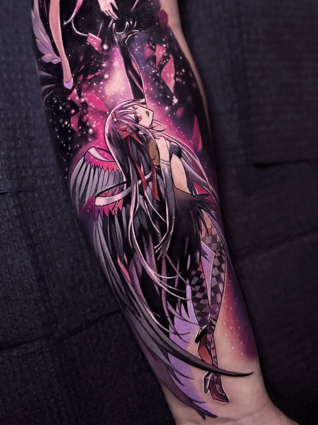 Anime character with wings realism tattoo on the forearm by Alex Moro