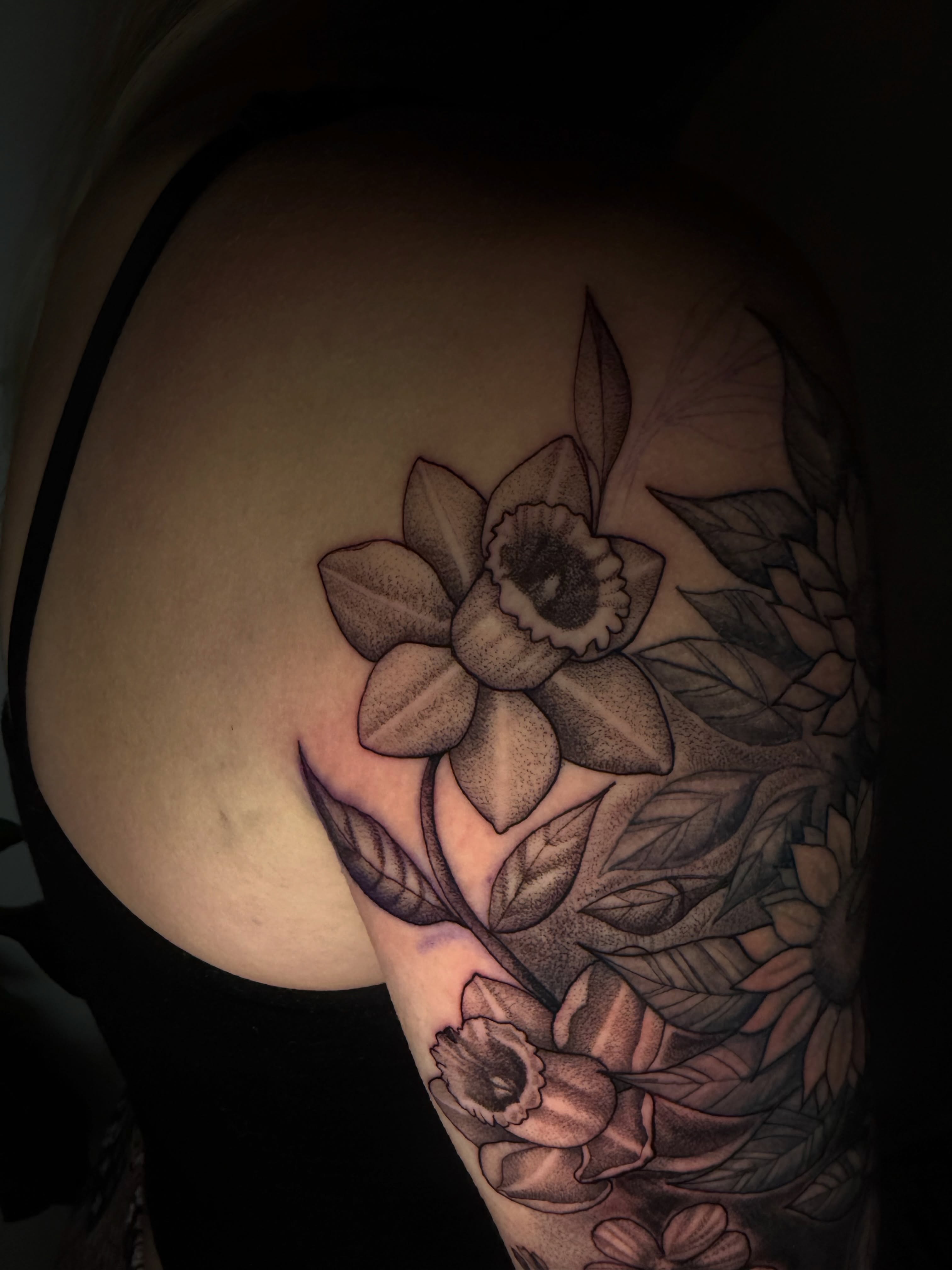 Daffodil dotwork tattoo on the shoulder by Pedro Sinhorini, Portland, Oregon