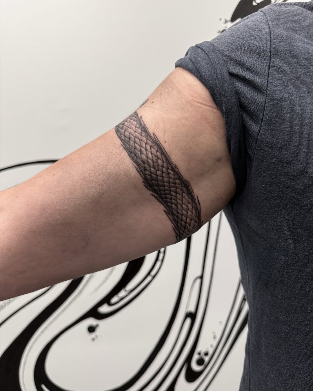Fish scales black and grey tattoo on the forearm by Brows & Tattoos