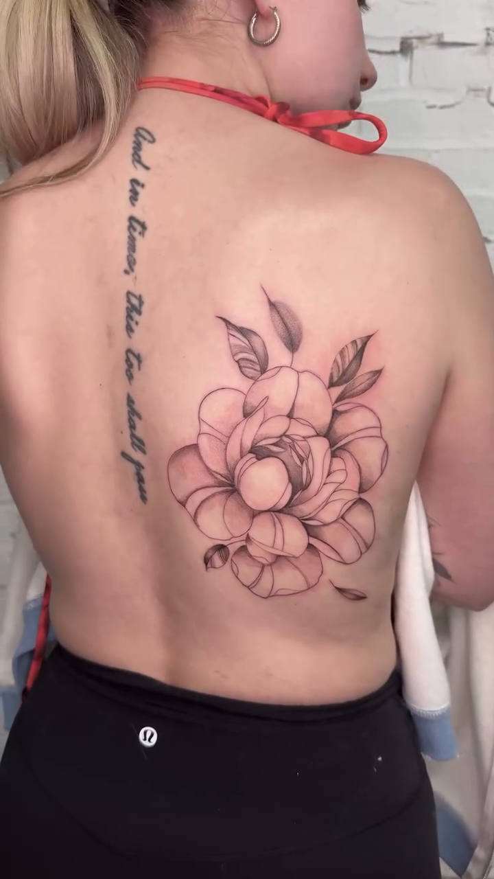 Flower and script fine line tattoo by Josh Infante