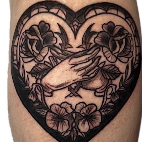 Praying hands within heart black and grey tattoo on the thigh by Misha Dumois, Seattle, Washington
