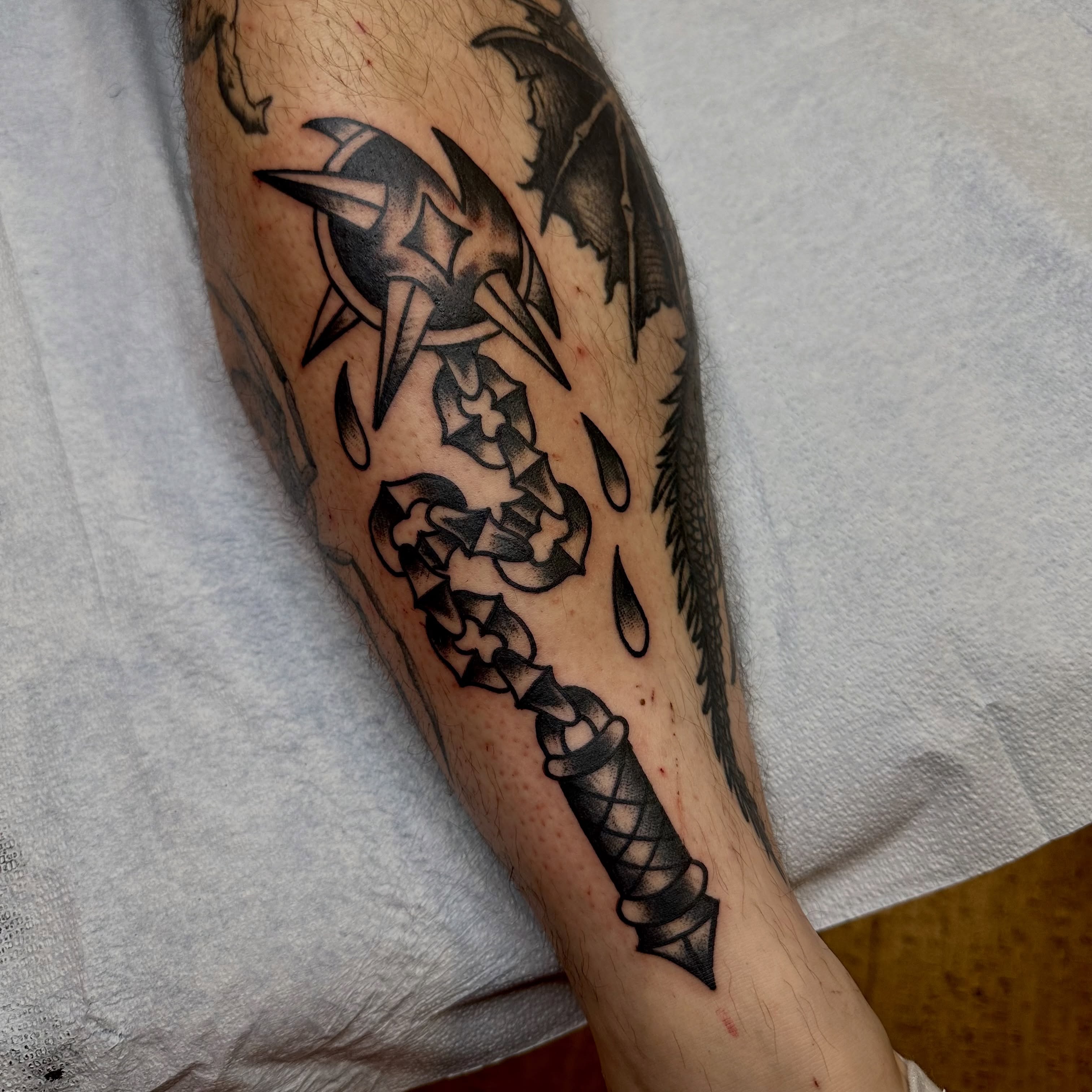 Sword and dragon black and grey tattoo on the forearm by teddy, Portland, Oregon