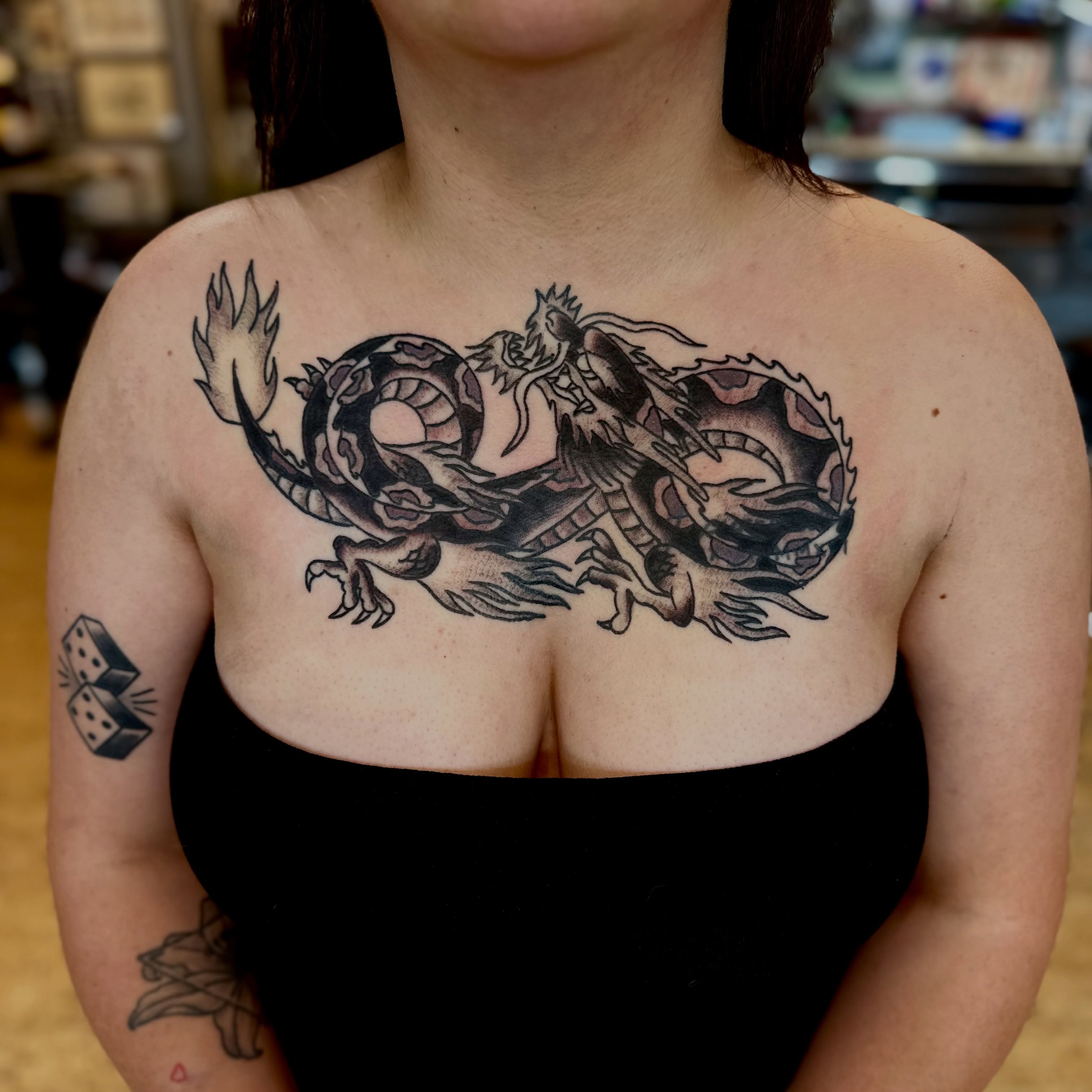 Dragon black and grey tattoo on the chest by teddy, Portland, Oregon