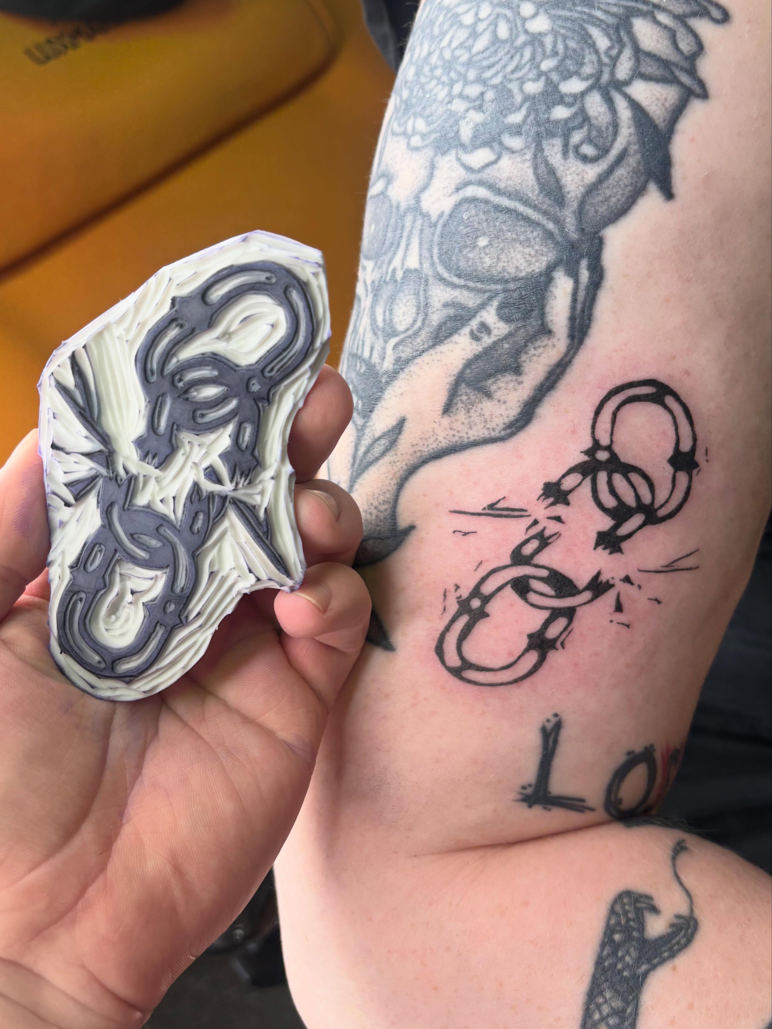 Snake black and grey tattoo on the forearm by Hiro Robinson