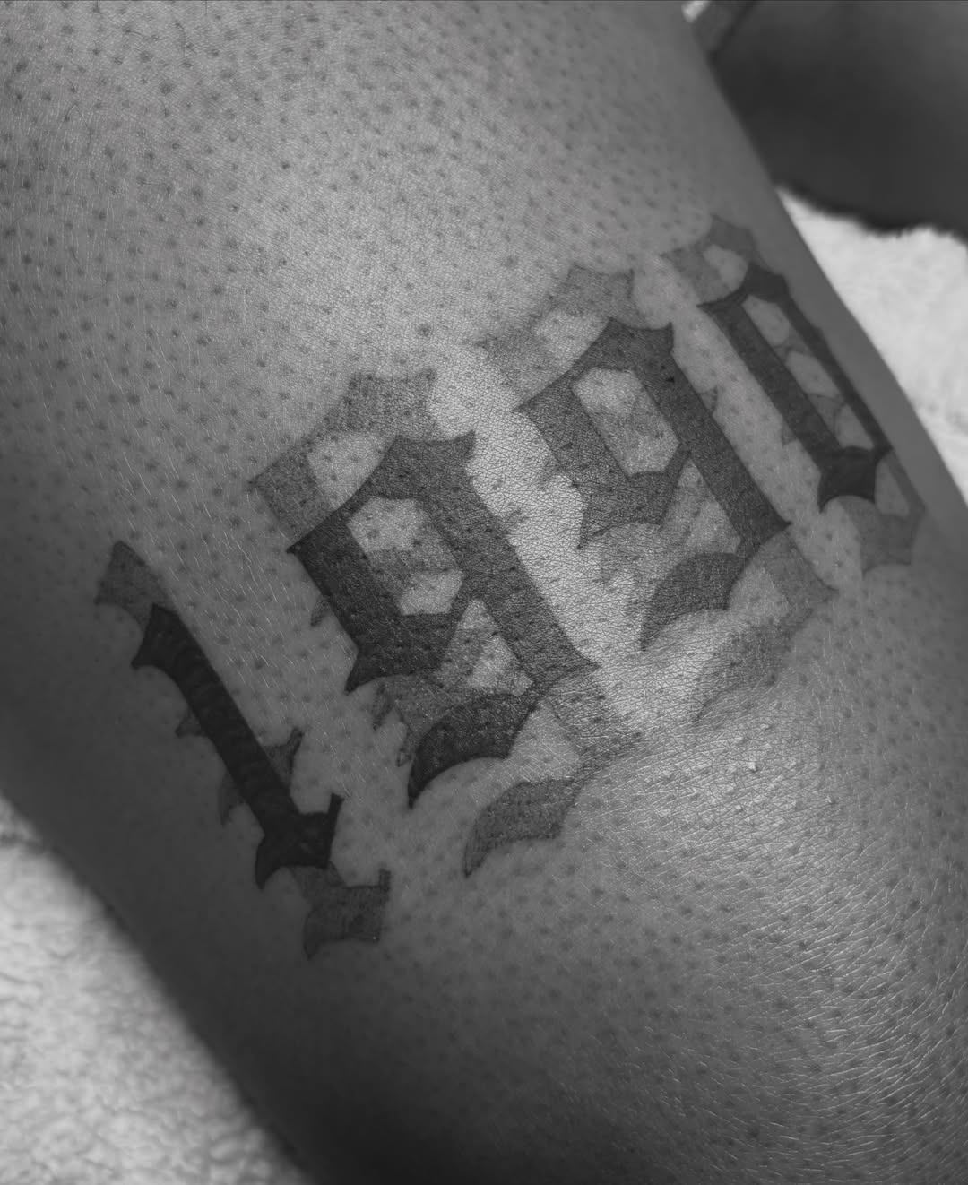 Lettering black and grey tattoo on the forearm by @secretlinetattoo