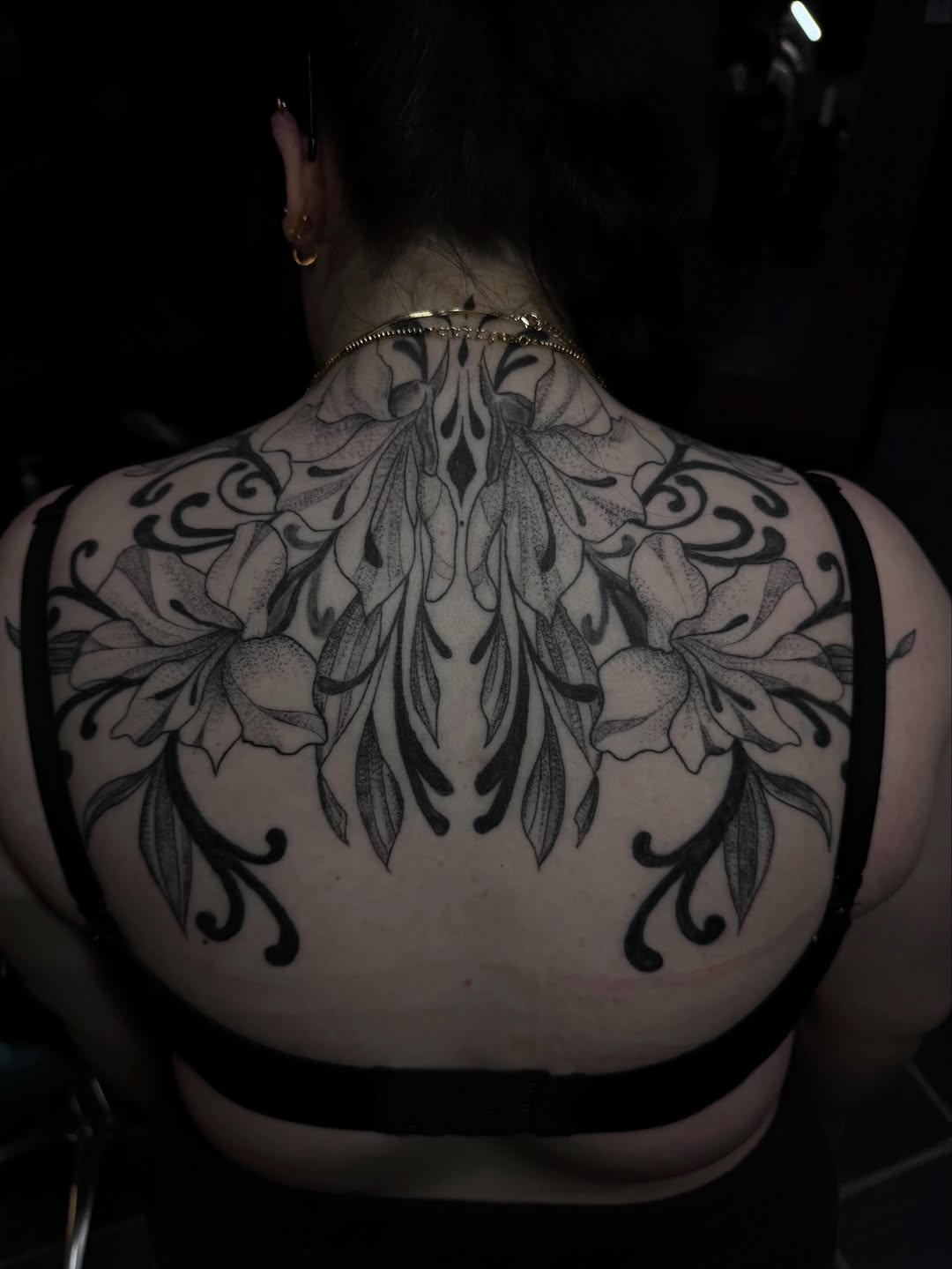 Floral ornamental back piece tribal tattoo on the back by olivia reed