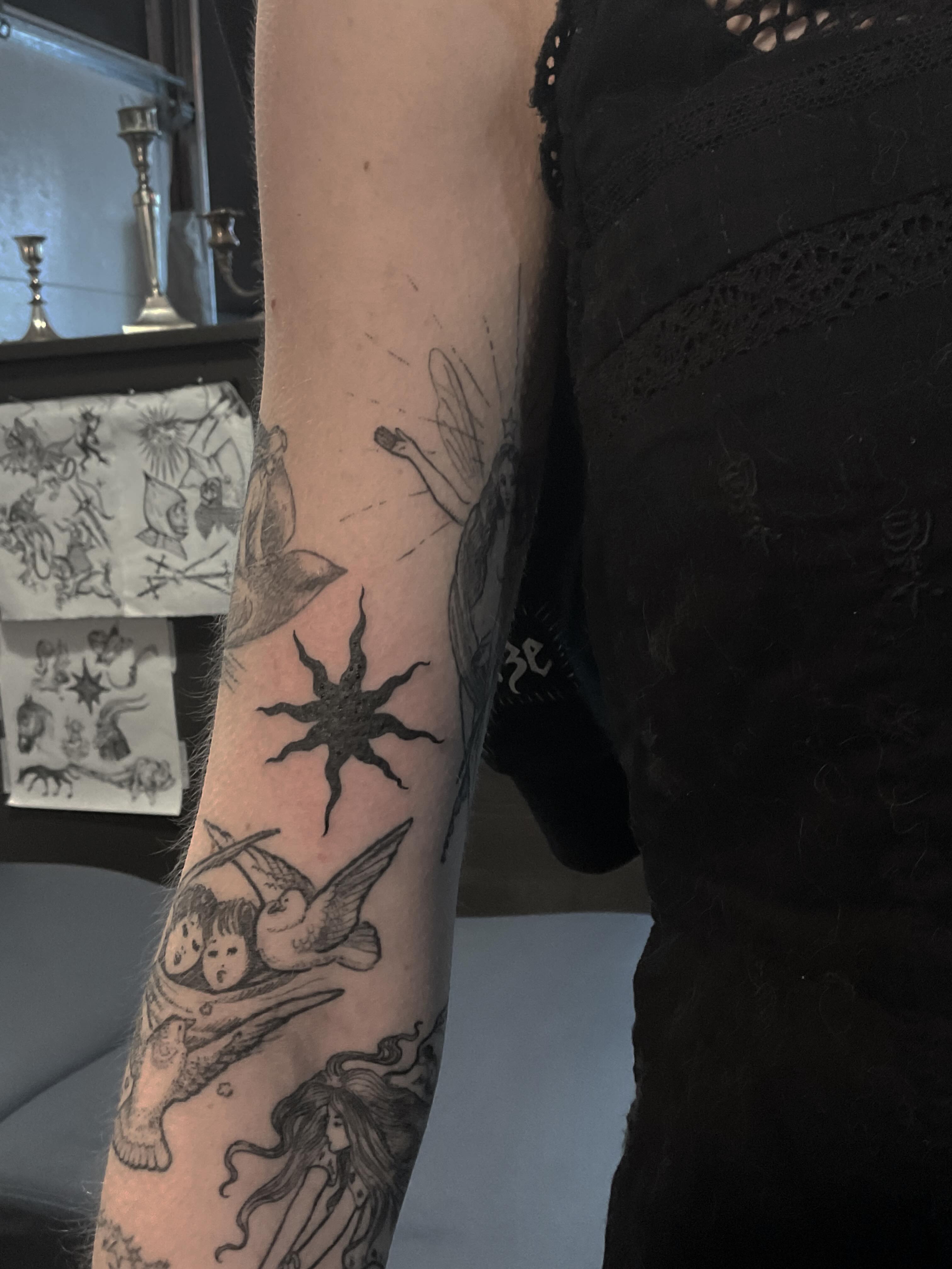 Angels and sun black and grey tattoo on the forearm by ๐ญ๐๐๐๐