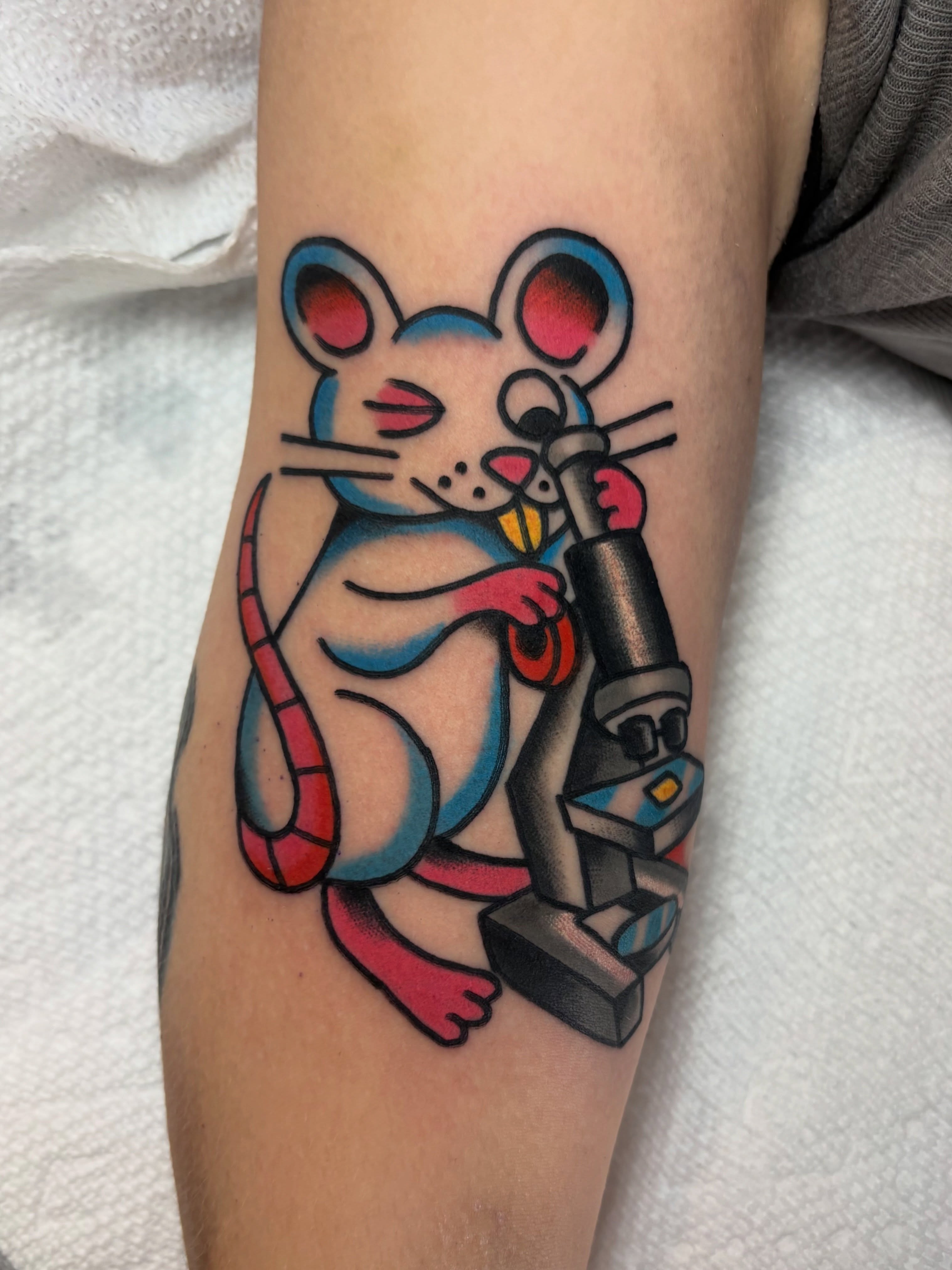 Mouse with microscope American traditional tattoo on the forearm by Traditional Tattooing