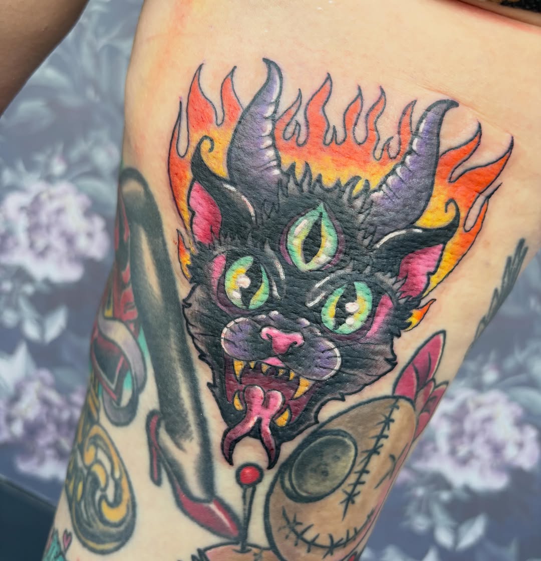 Demon head American traditional tattoo on the thigh by Bre Alex