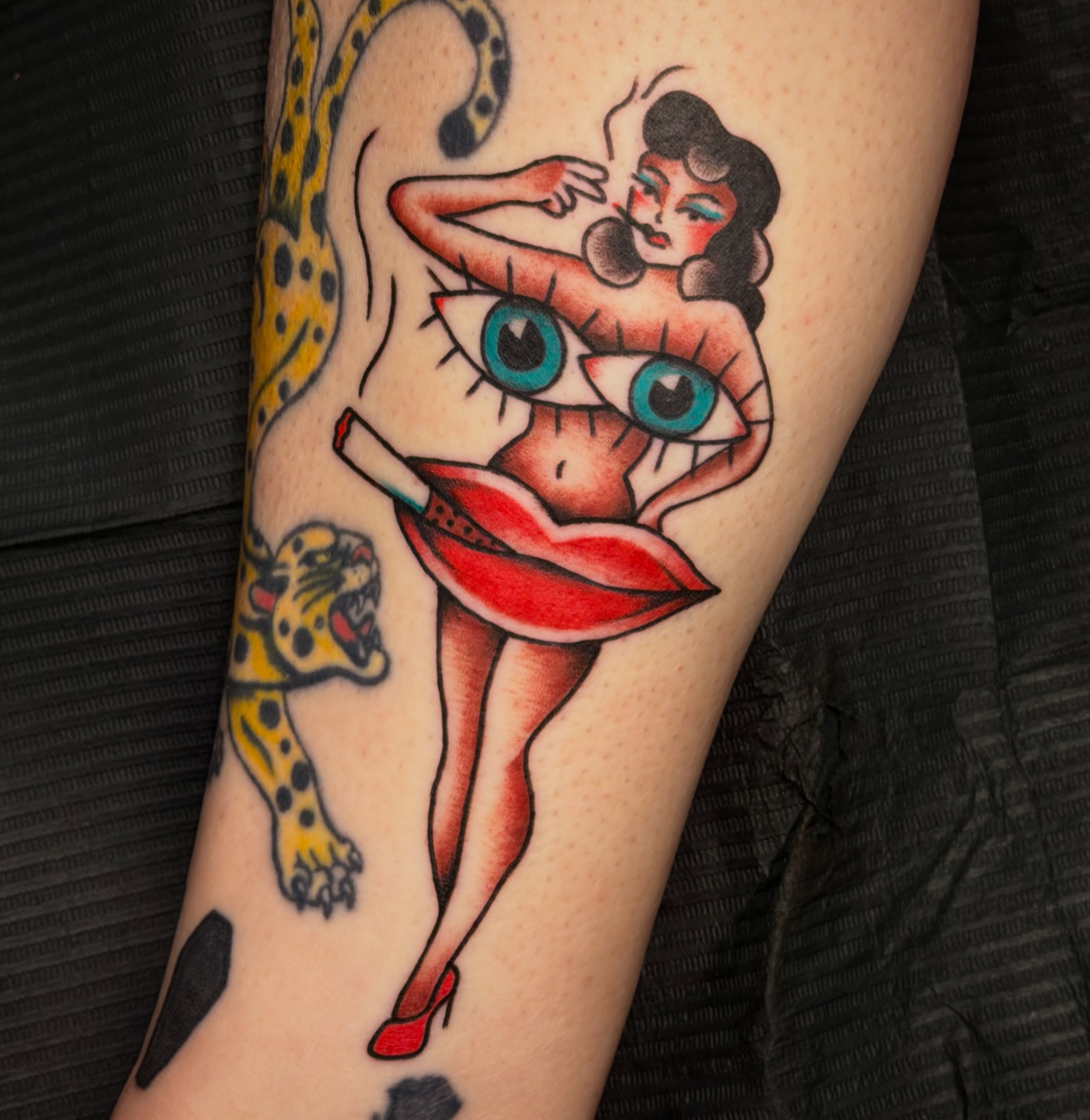 Pin-up girl with leopard American traditional tattoo on the forearm by abbey pickens 🧚 cleveland ohio