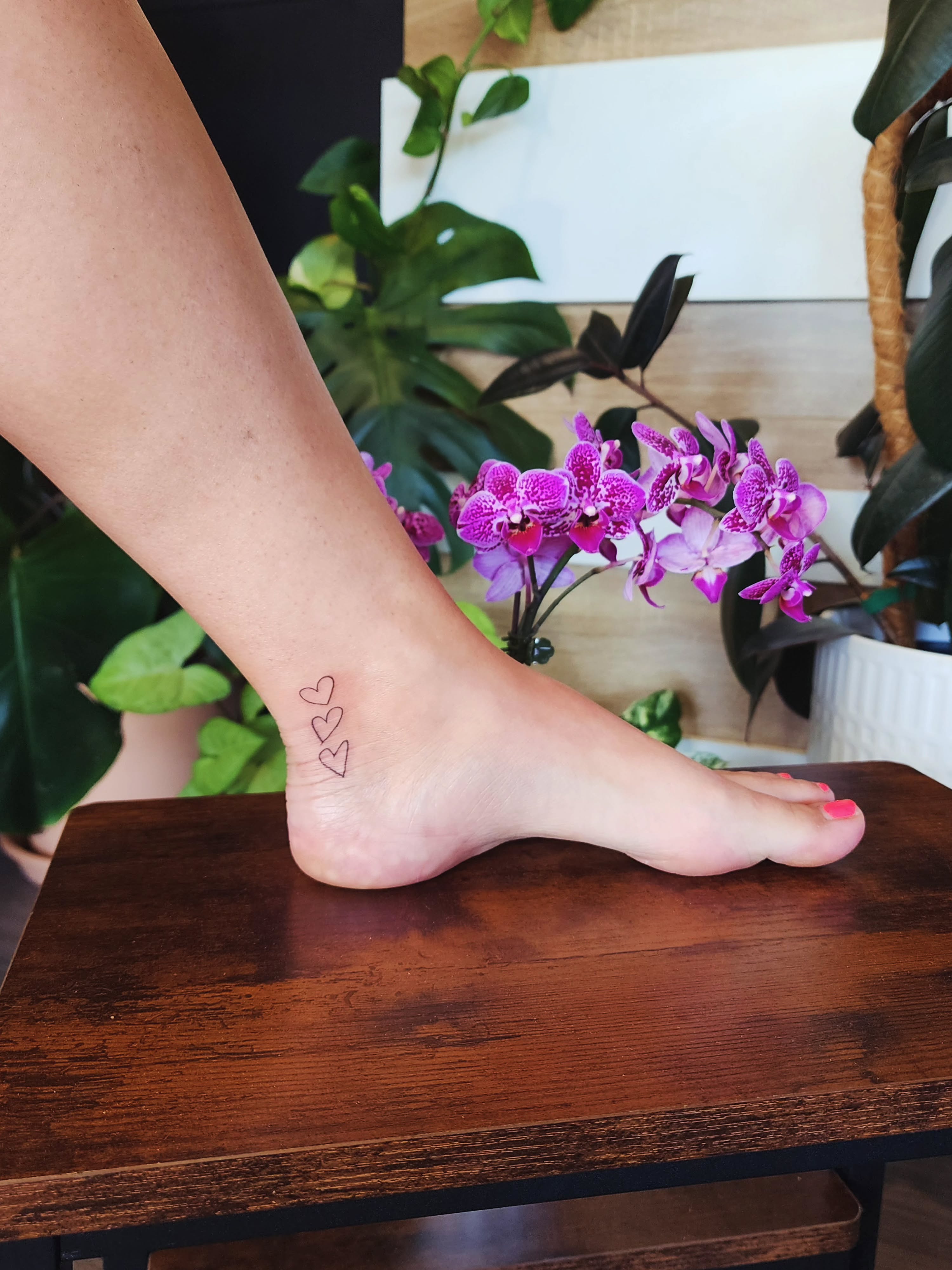 Three hearts fine line tattoo on the foot by Alex ▪︎ Tattoo Apprentice