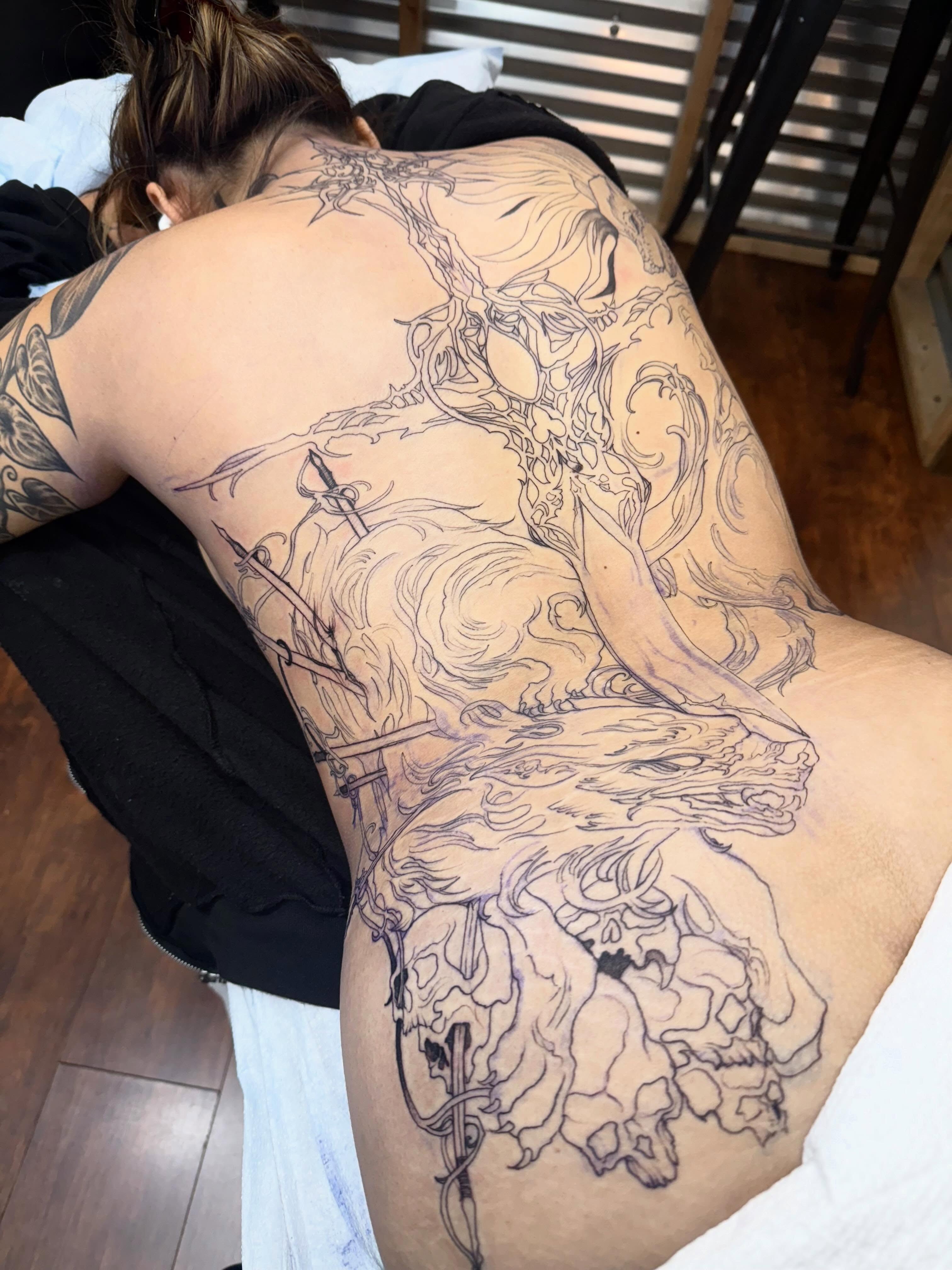 Mythical creature realism tattoo on the back by Isabella π€
