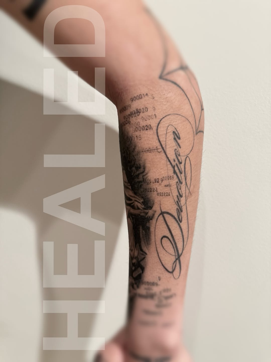 Script lettering and numbers sketch tattoo on the forearm by Ava De La Torre