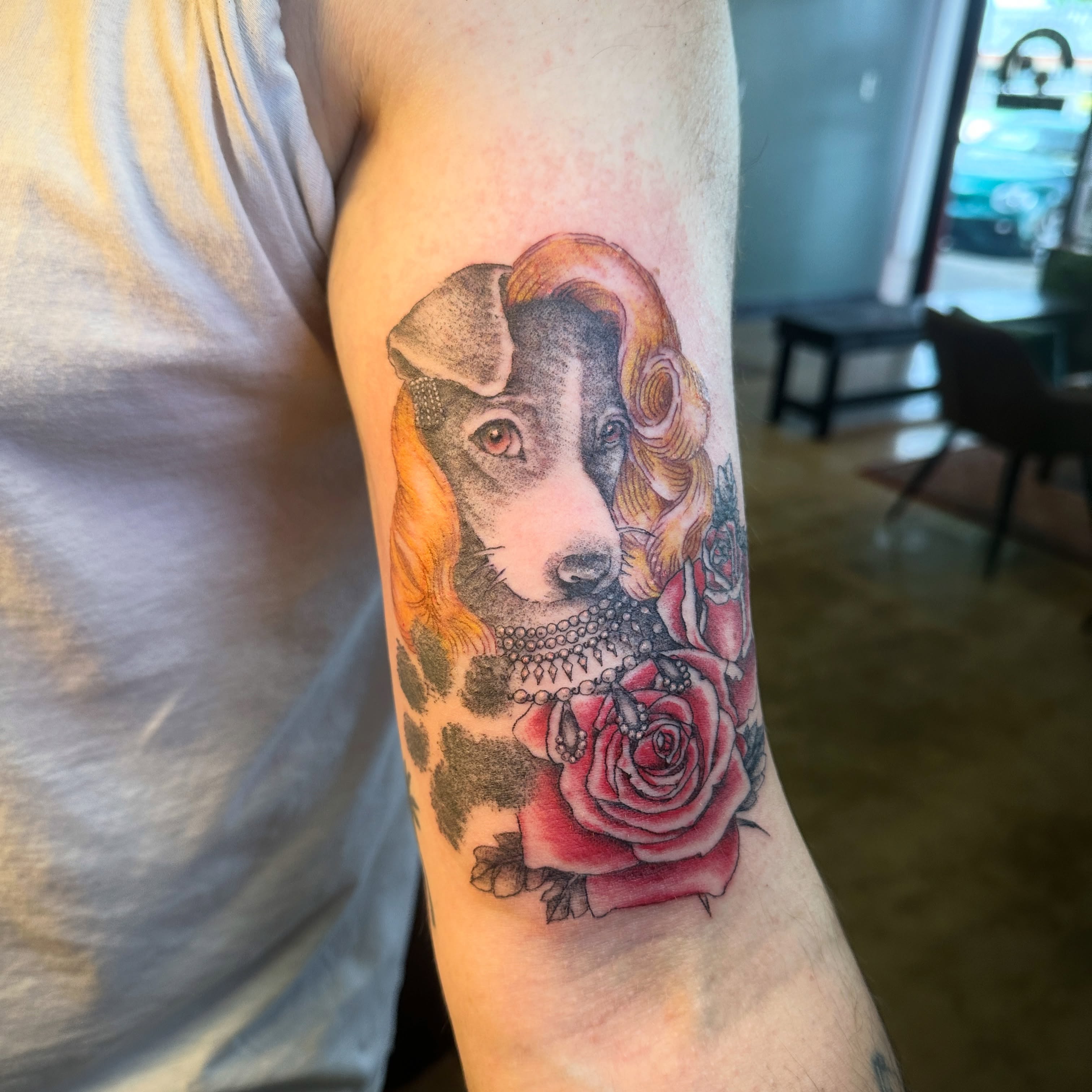 Dog with roses dotwork tattoo on the forearm by Luisa Gonzalez, Austin, Texas