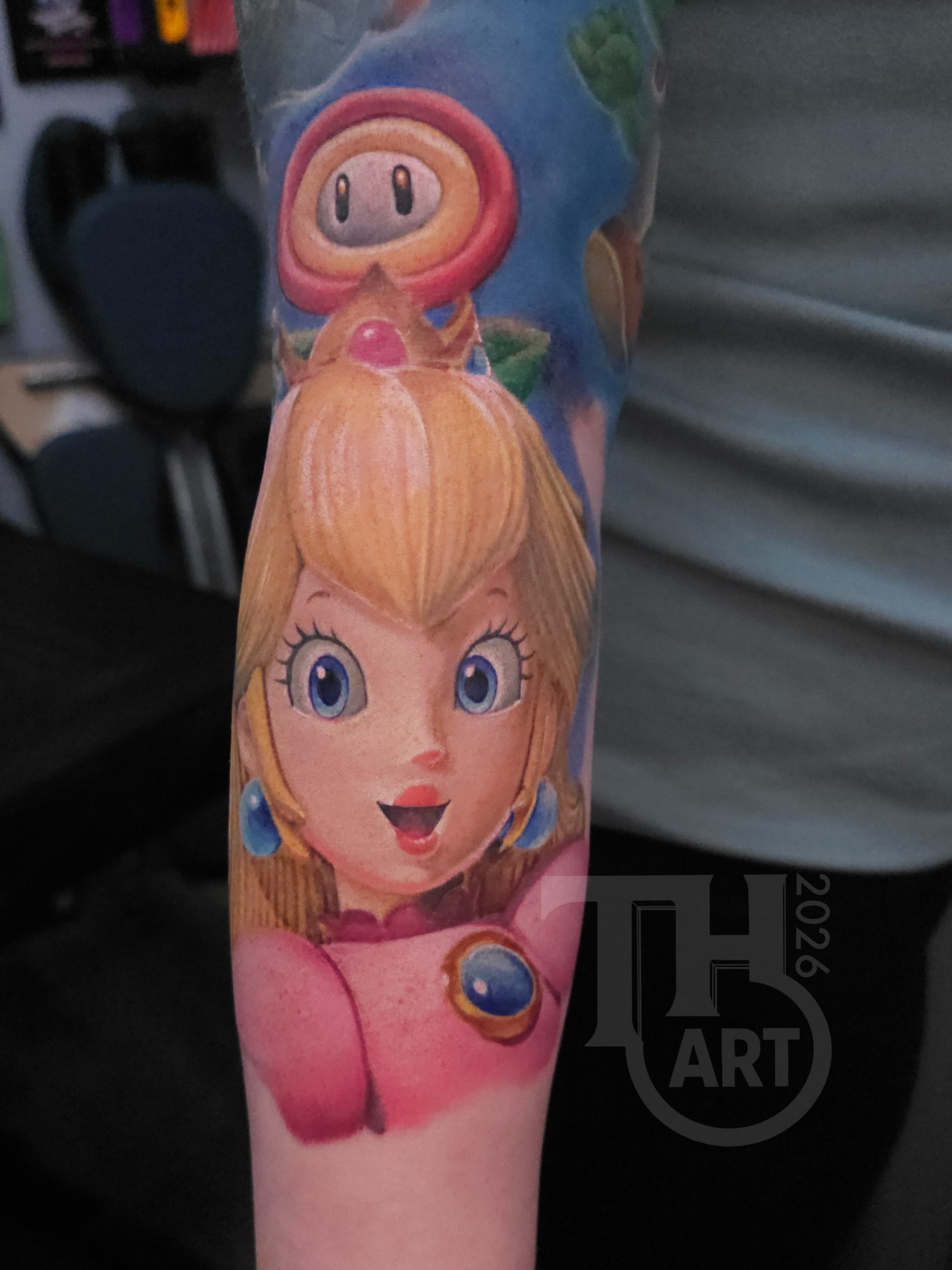 Princess Peach realism tattoo on the forearm by Thomas Harris