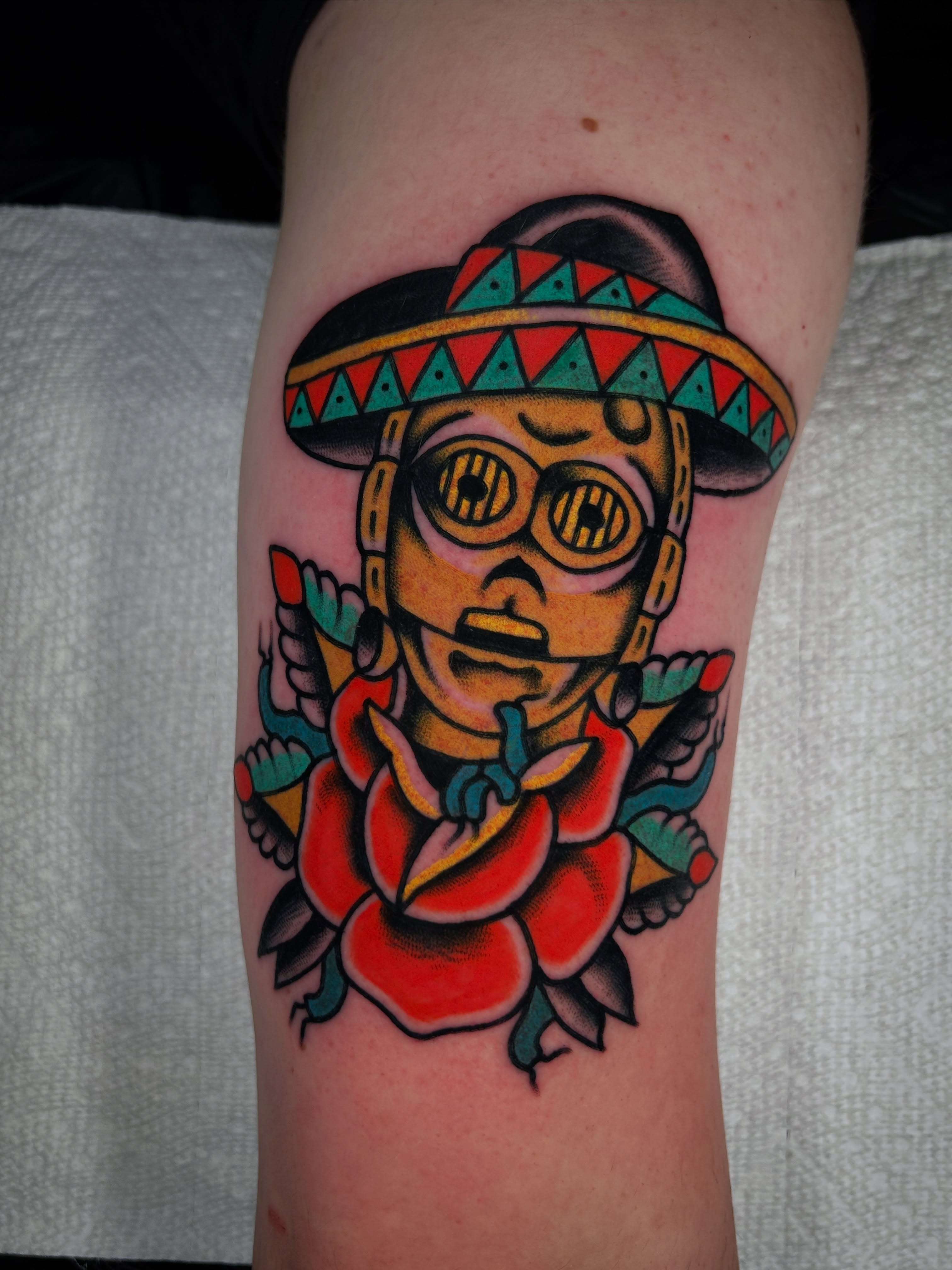 Sombrero-wearing character American traditional tattoo on the forearm by Kit Miller, Indianapolis, Indiana