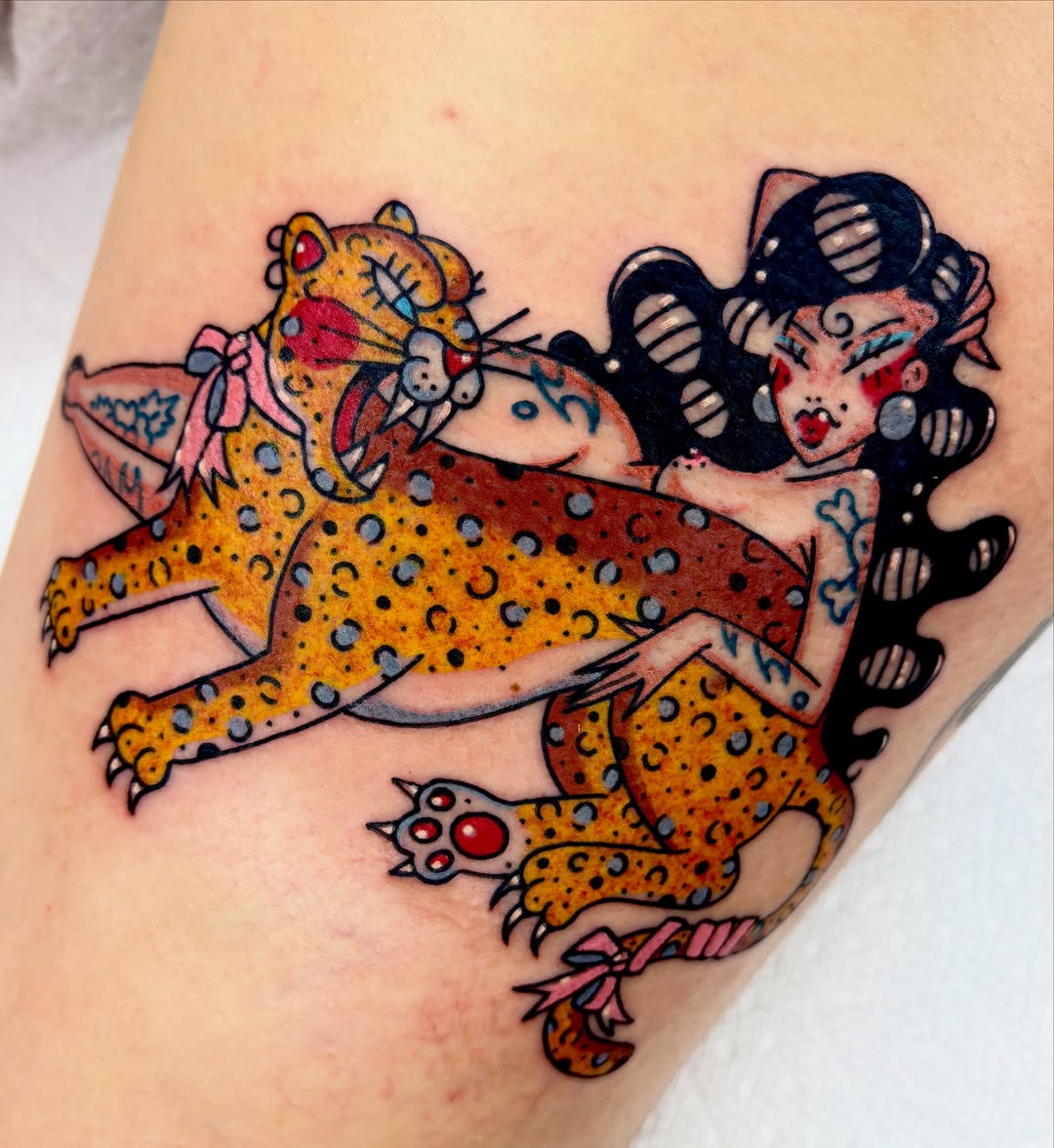 Jaguar and woman American traditional tattoo on the thigh by Bella