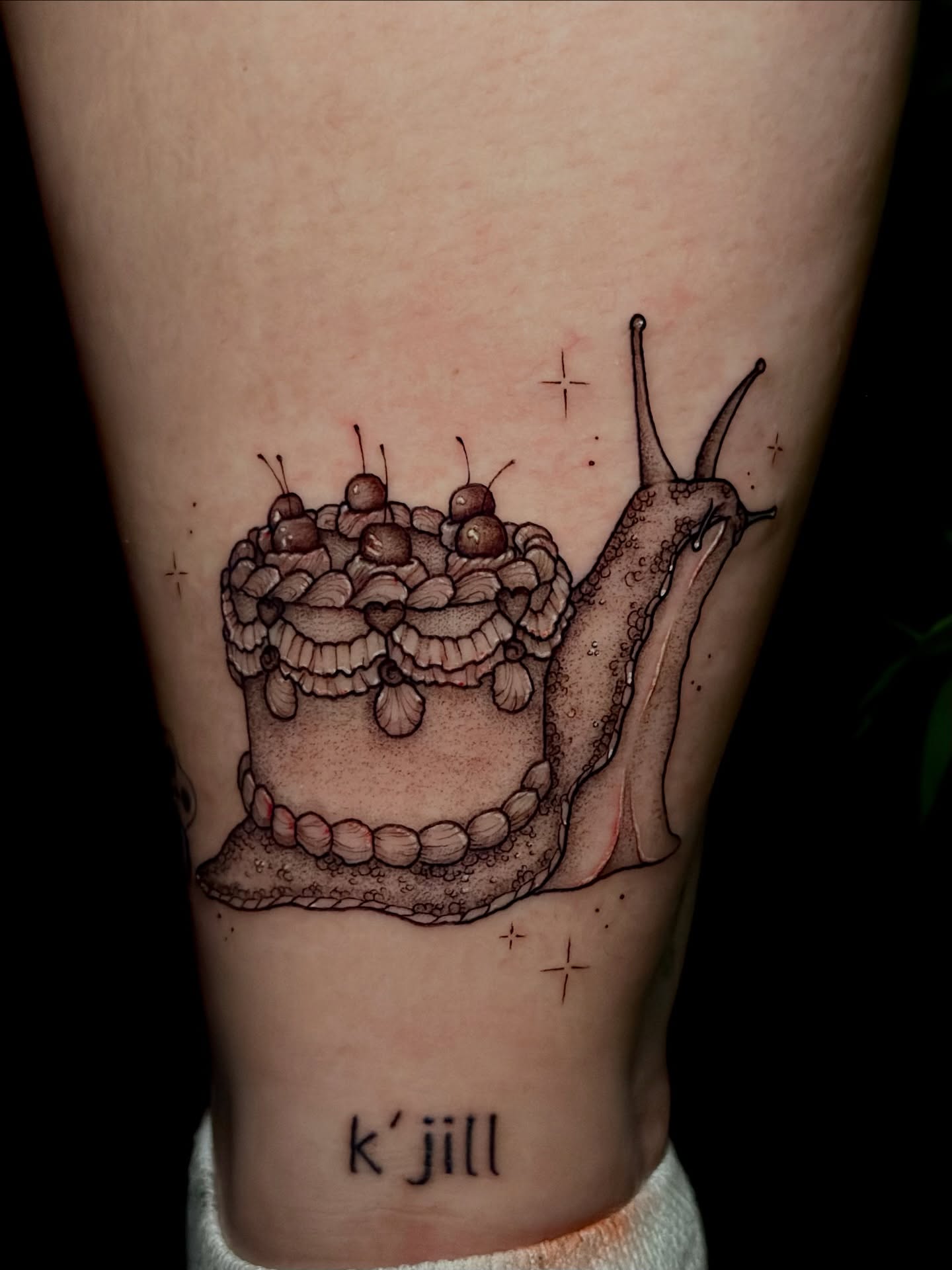 Snail cake realism tattoo on the thigh by Sabrina, Harrison, New Jersey