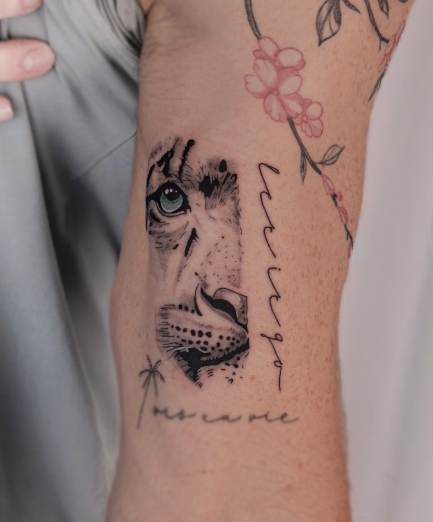 Lion face dotwork tattoo on the forearm by Charlotte