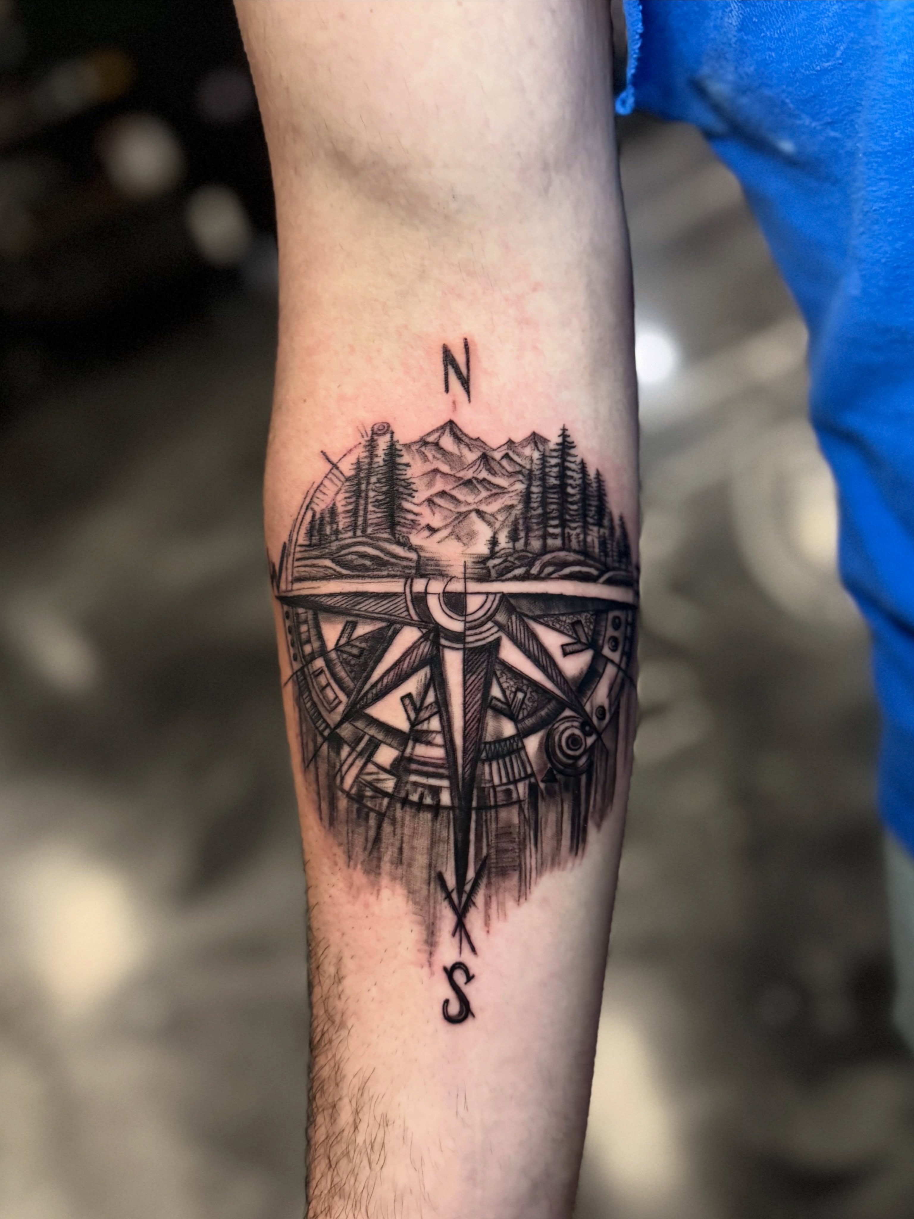 Compass with landscape geometric tattoo on the forearm by Paola Pineda Tattoo, Knoxville, Tennessee