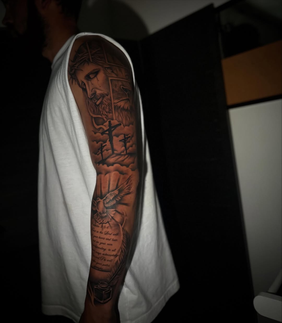 Religious scene realism tattoo on the forearm by Sad Girl Tattoos