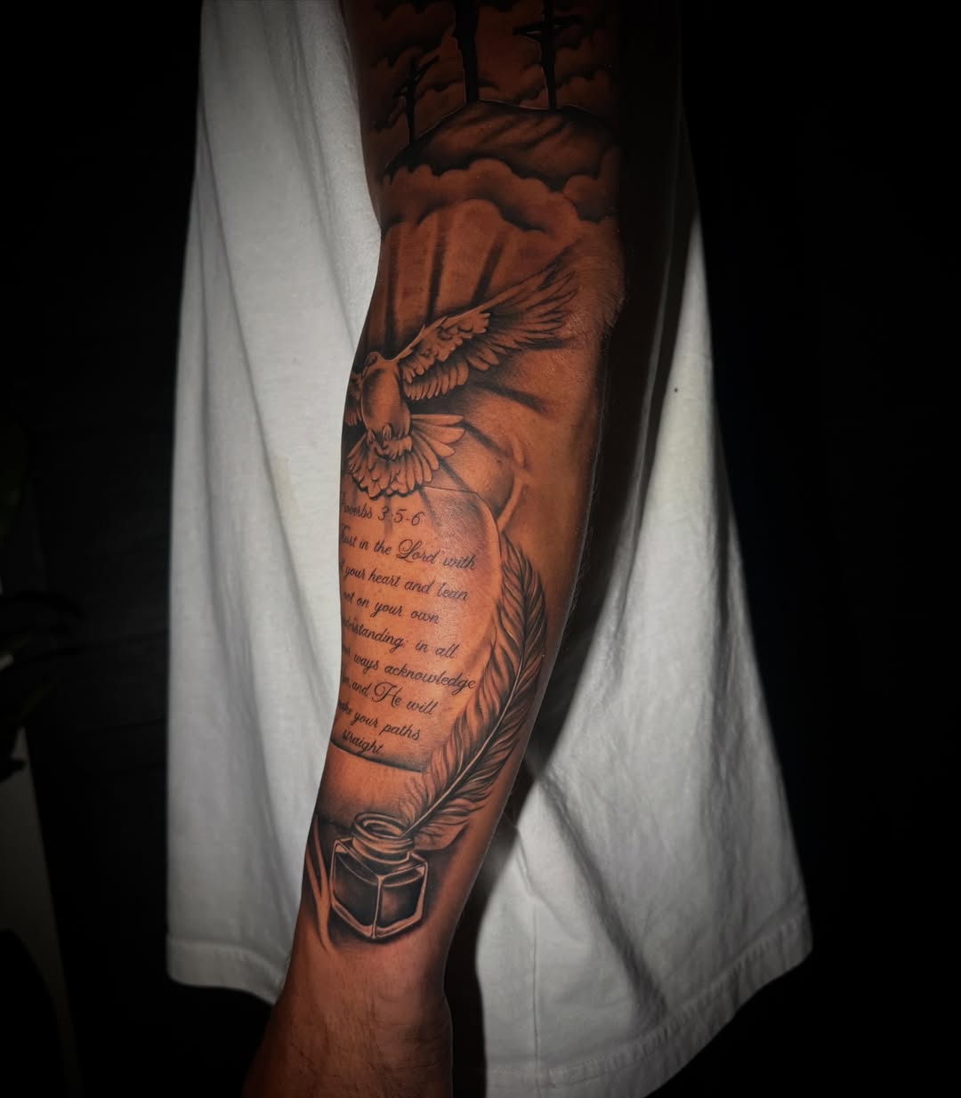 Bird and feather realism tattoo on the forearm by Sad Girl Tattoos