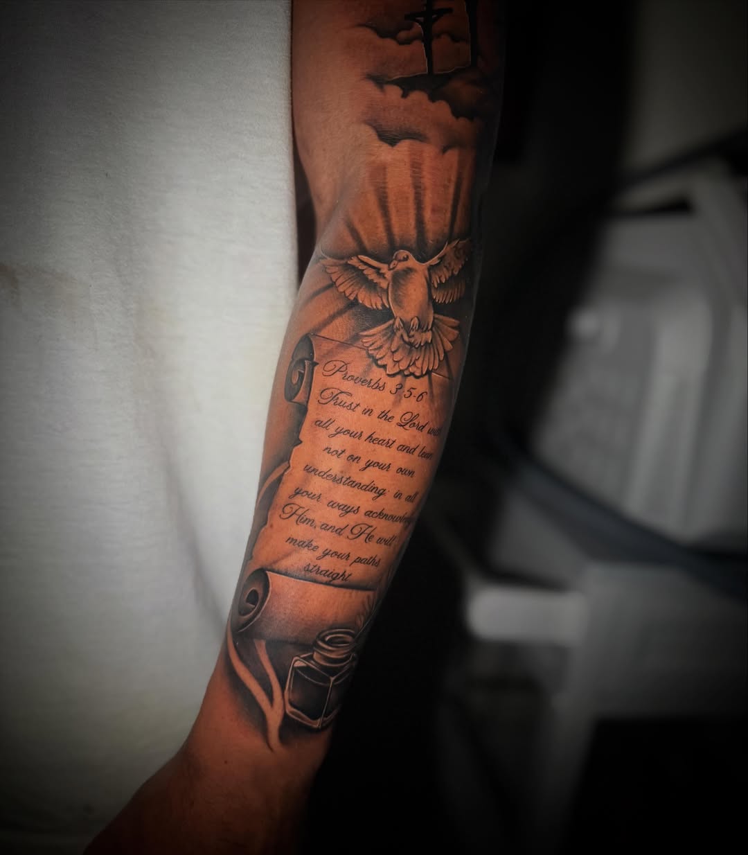 Religious verse black and grey tattoo on the forearm by Sad Girl Tattoos