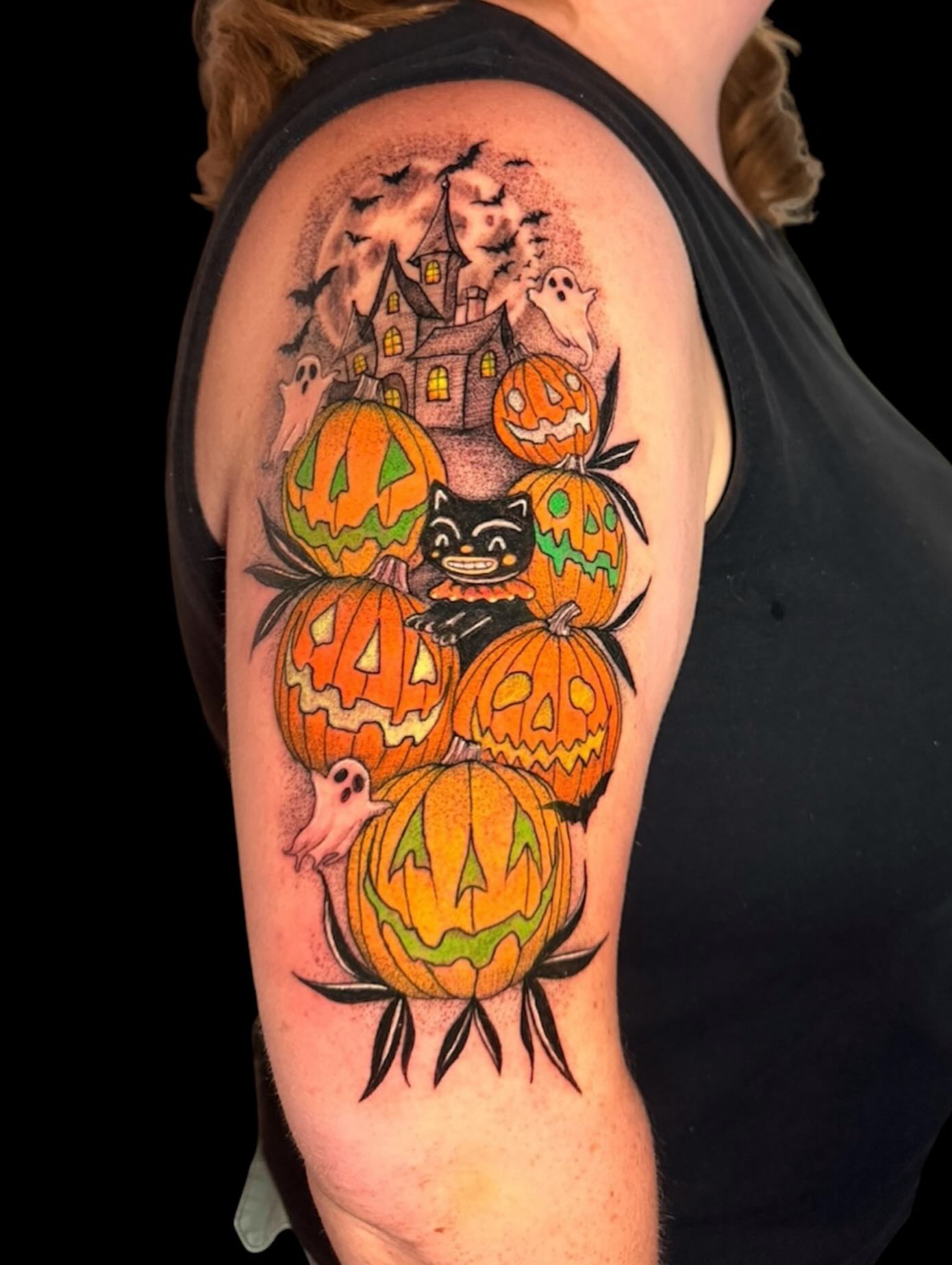 Halloween-themed pumpkins American traditional tattoo on the shoulder by Gabrielle Frelak, York, Pennsylvania