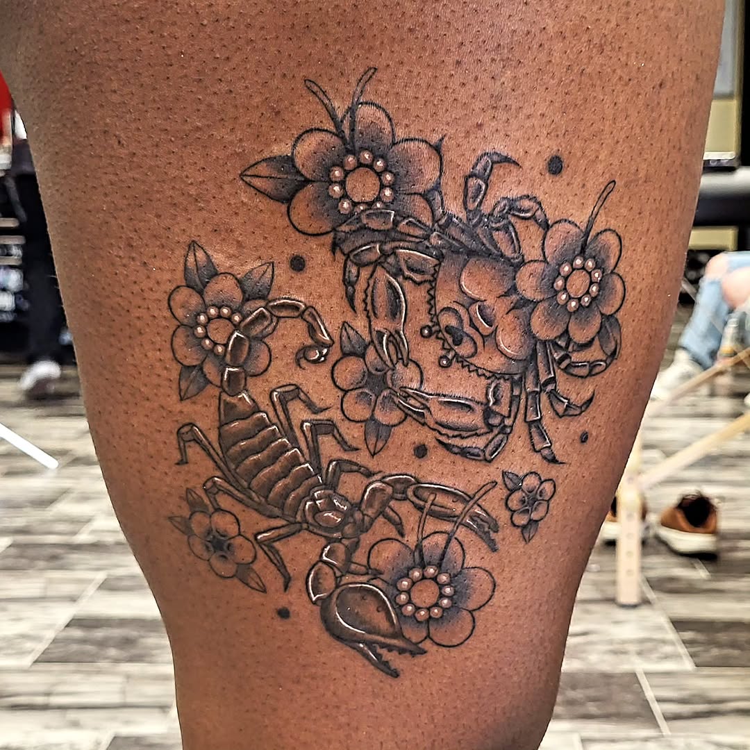 Scorpion and crab with flowers fine line tattoo on the thigh by TEA ☕️ Tattoos