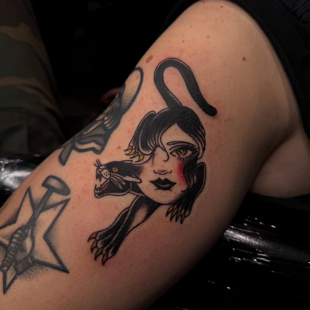 Woman with bird American traditional tattoo on the forearm by Mercy Dean