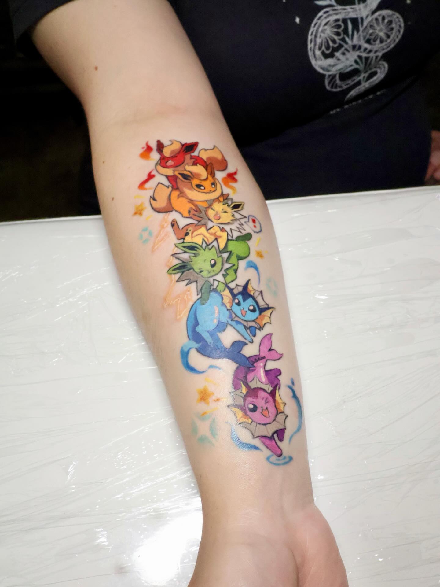 Pokรฉmon characters anime tattoo on the forearm by ๐๐๐โฆ้ชๆขจ๐