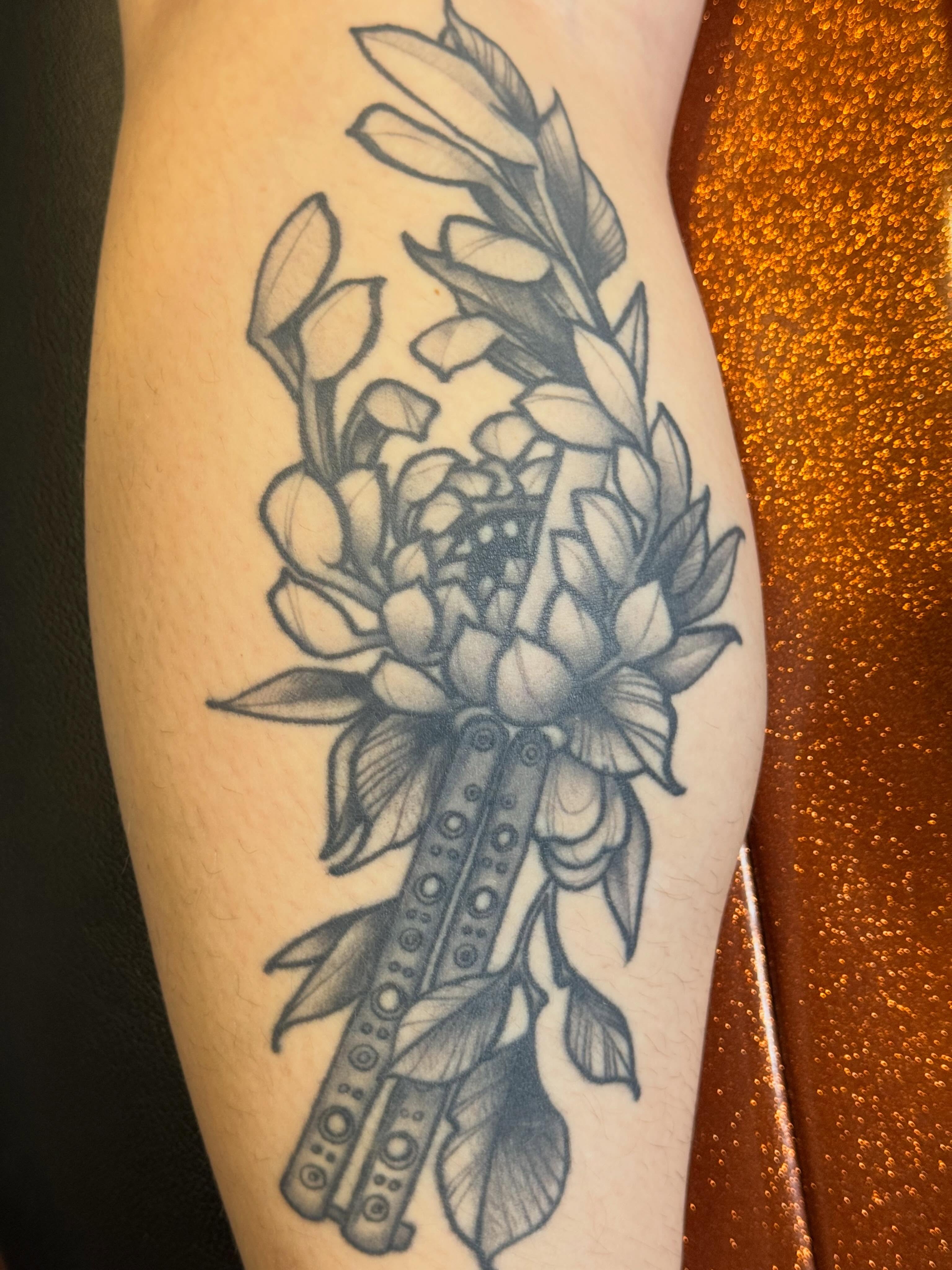 Lotus flower bouquet dotwork tattoo on the forearm by Mike Bean, Minneapolis, Minnesota
