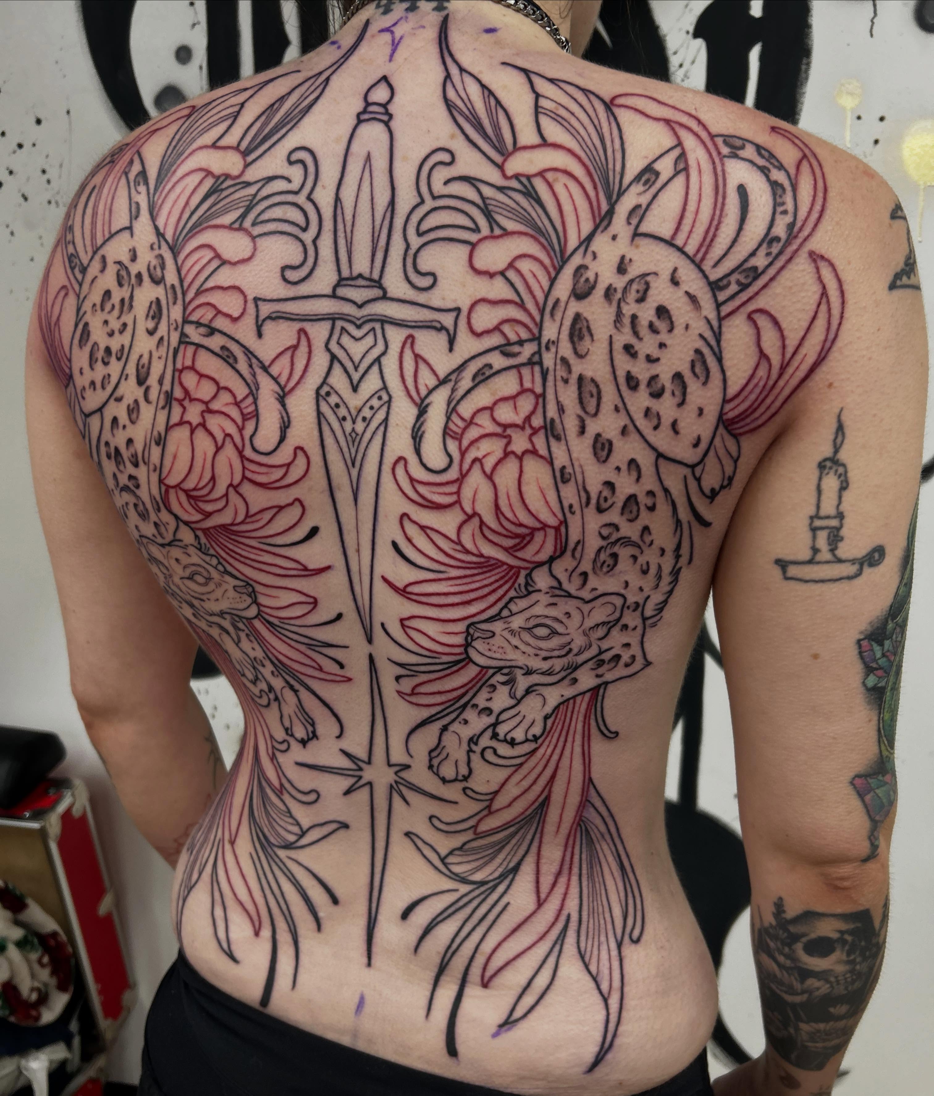 Leopard and chrysanthemum American traditional tattoo on the back by Kayla Fay, Baton Rouge, Louisiana