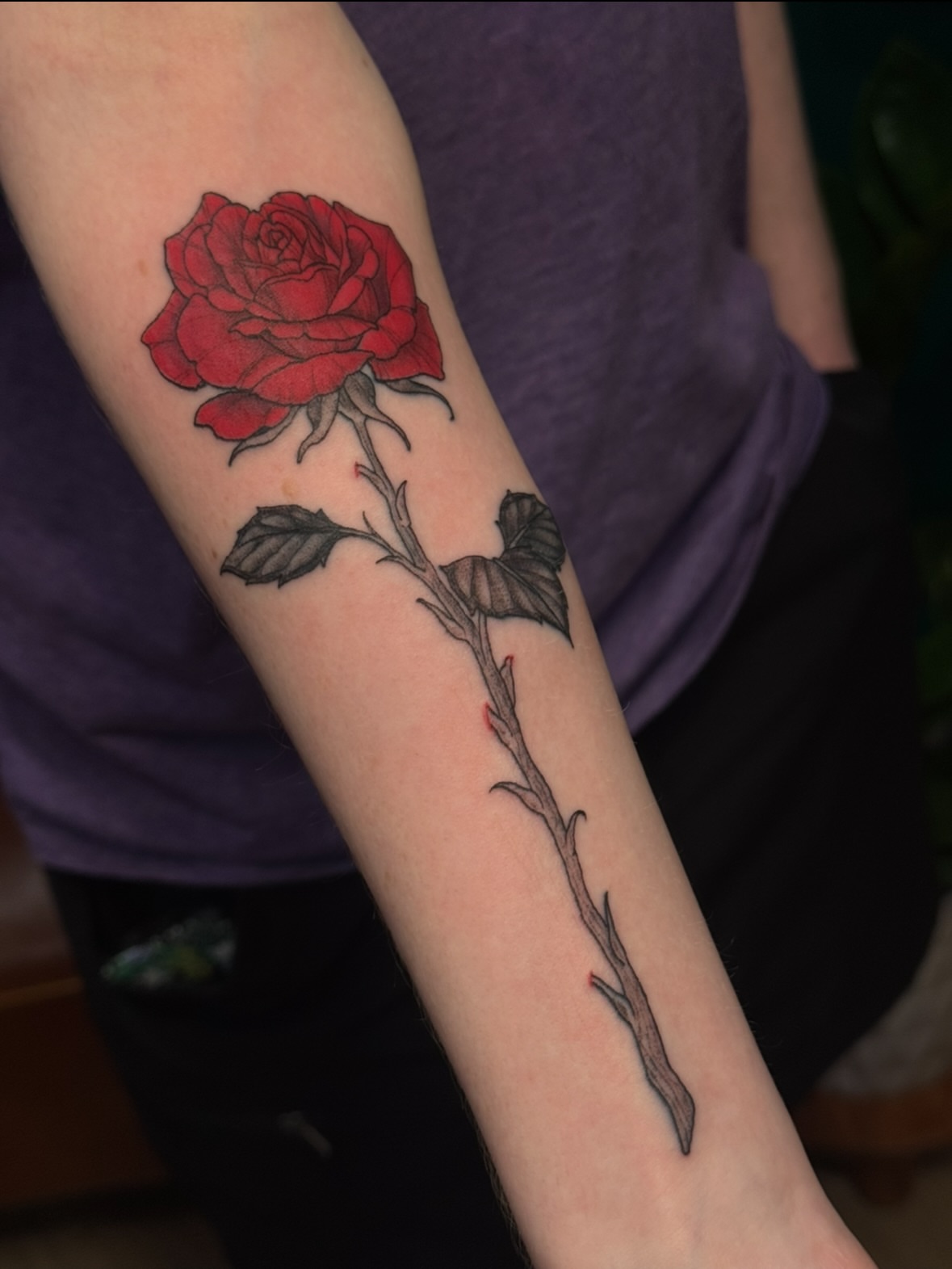 Red rose realism tattoo on the forearm by jess jené jones, Portland, Oregon