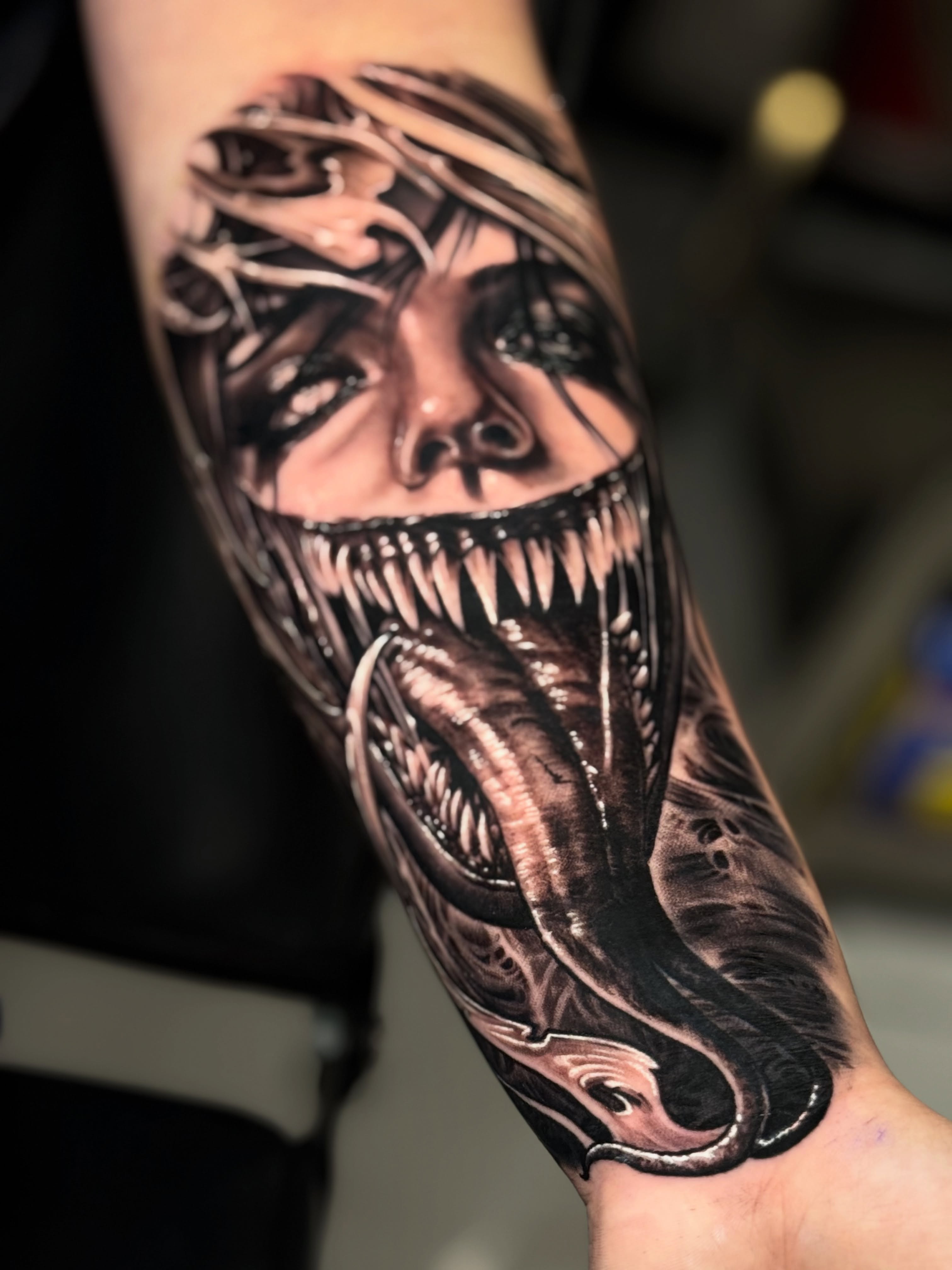 Venom realism tattoo on the forearm by Sergio Mendez