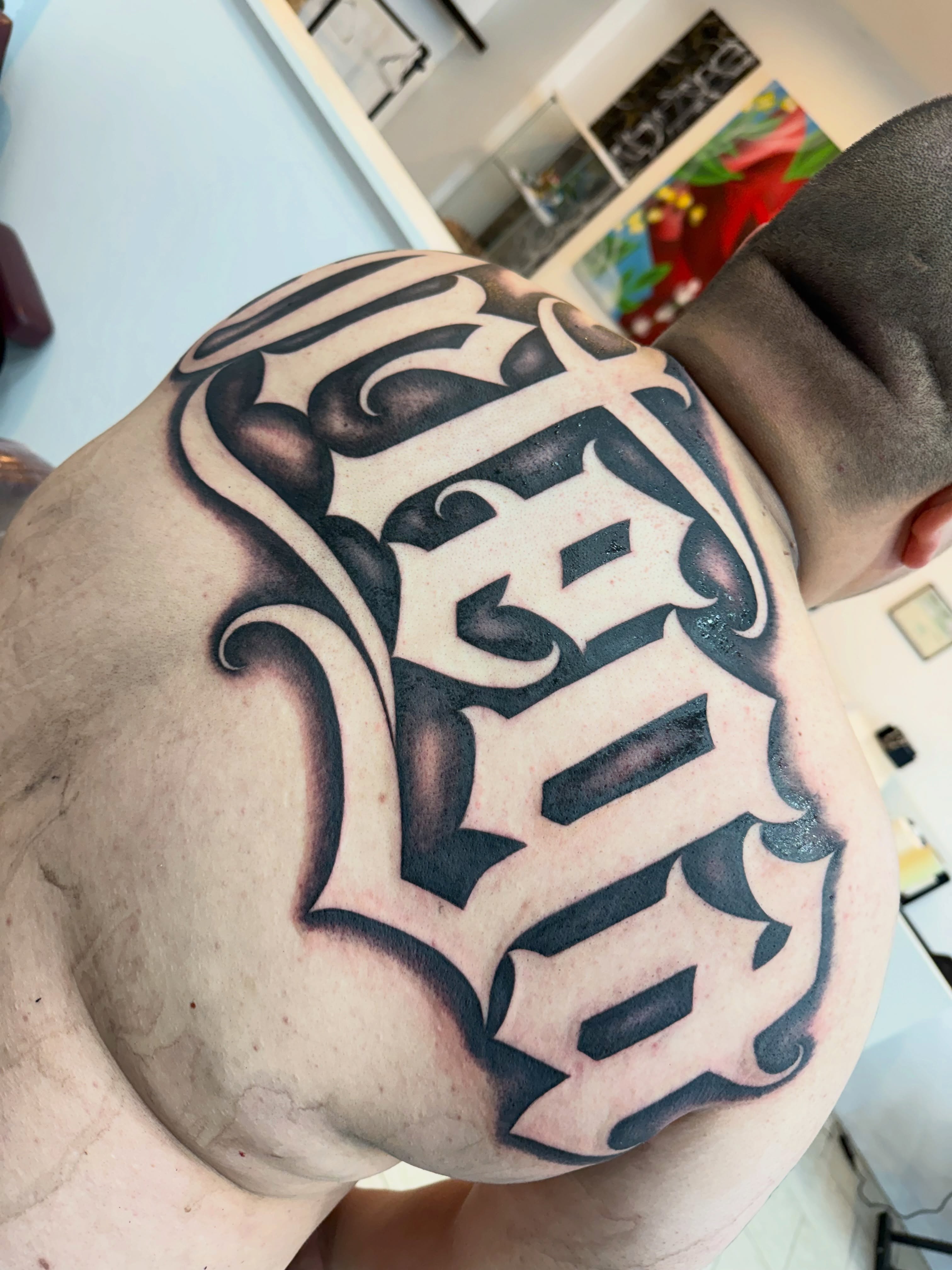 Geometric pattern tribal tattoo on the thigh by Daniel Lopez Tattoos