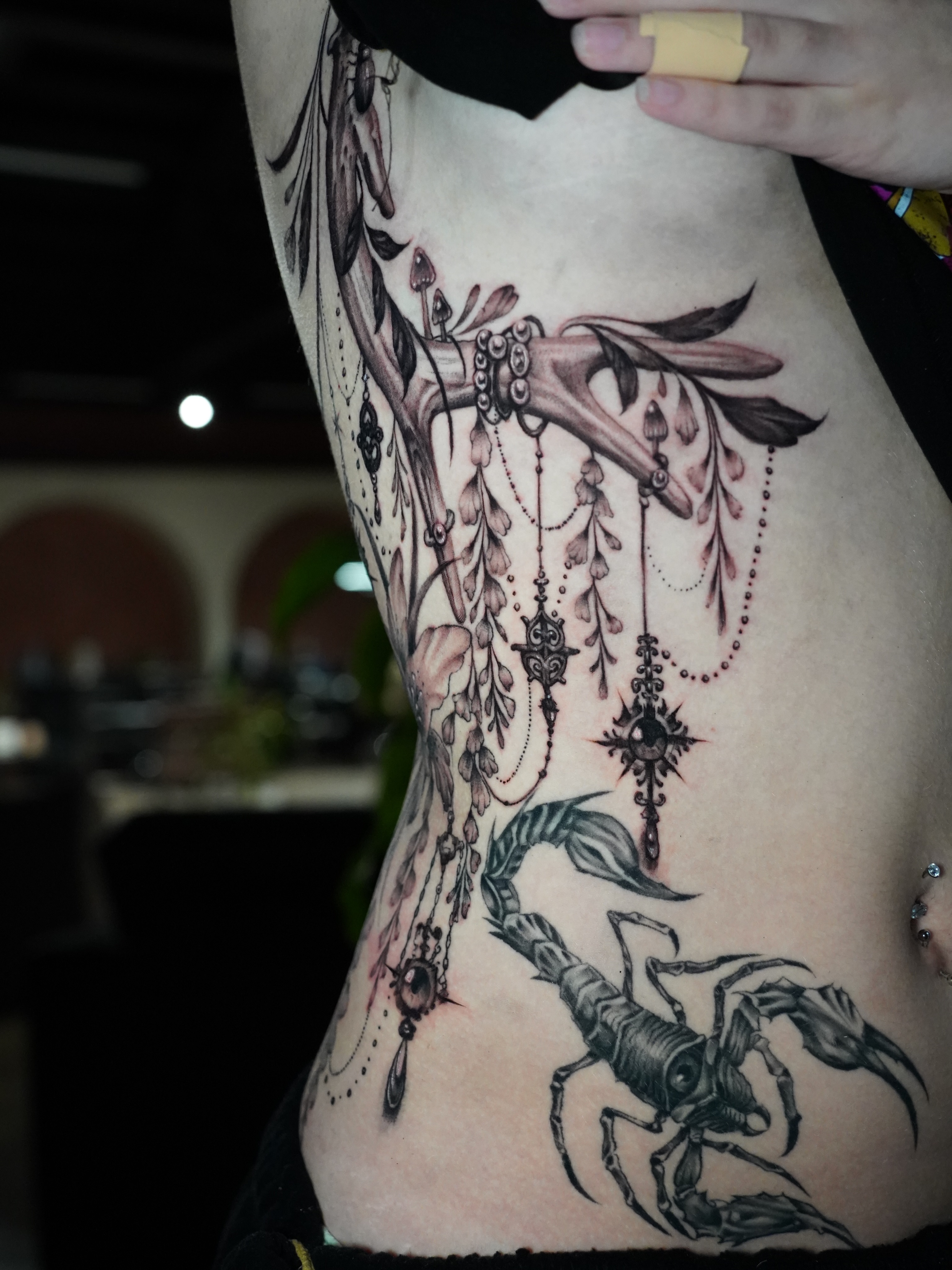 Scorpion and branches realism tattoo on the ribs by Grace P