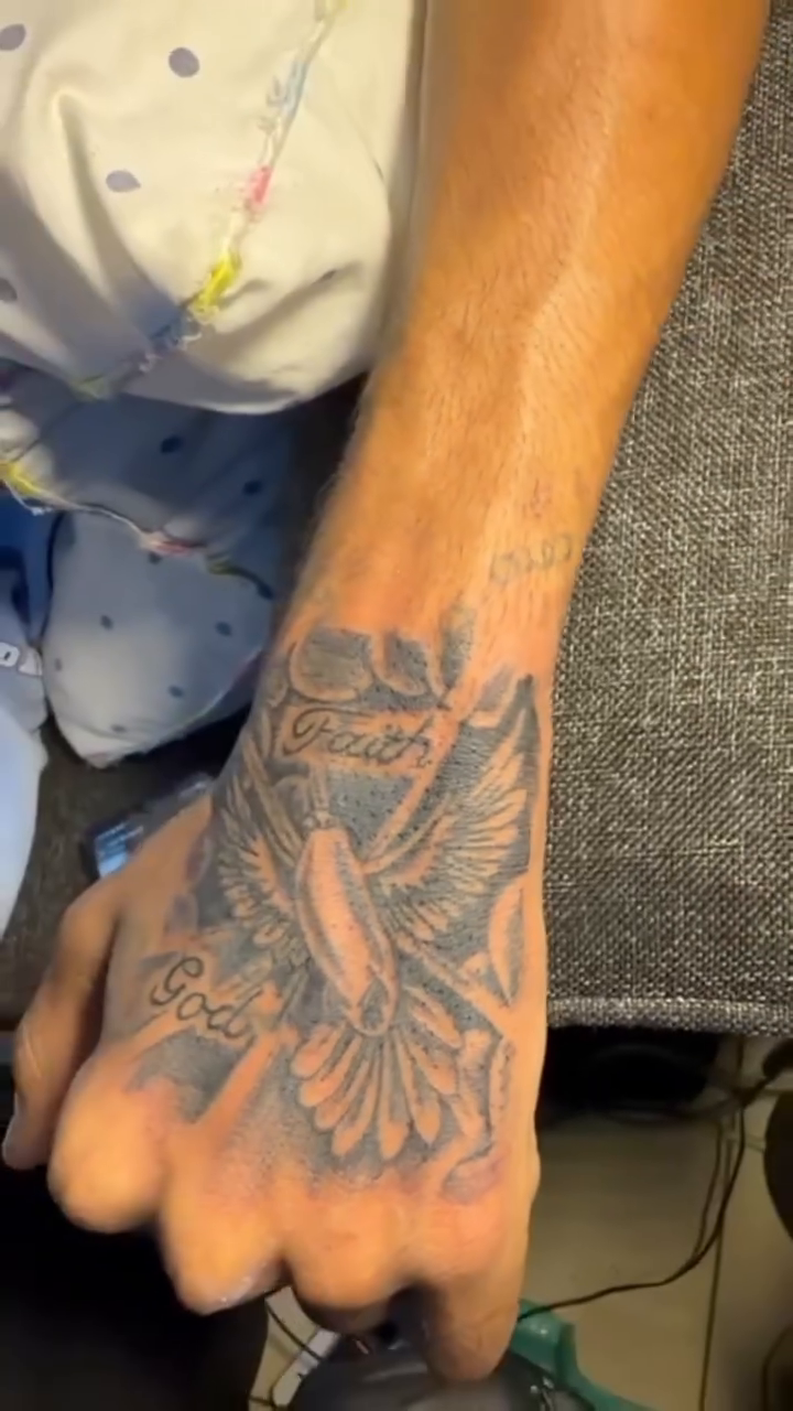 Dove with "Faith" and "God" text Chicano tattoo on the forearm by Mwangaza Bodyworks, Uthiru, Nairobi Area, Kenya
