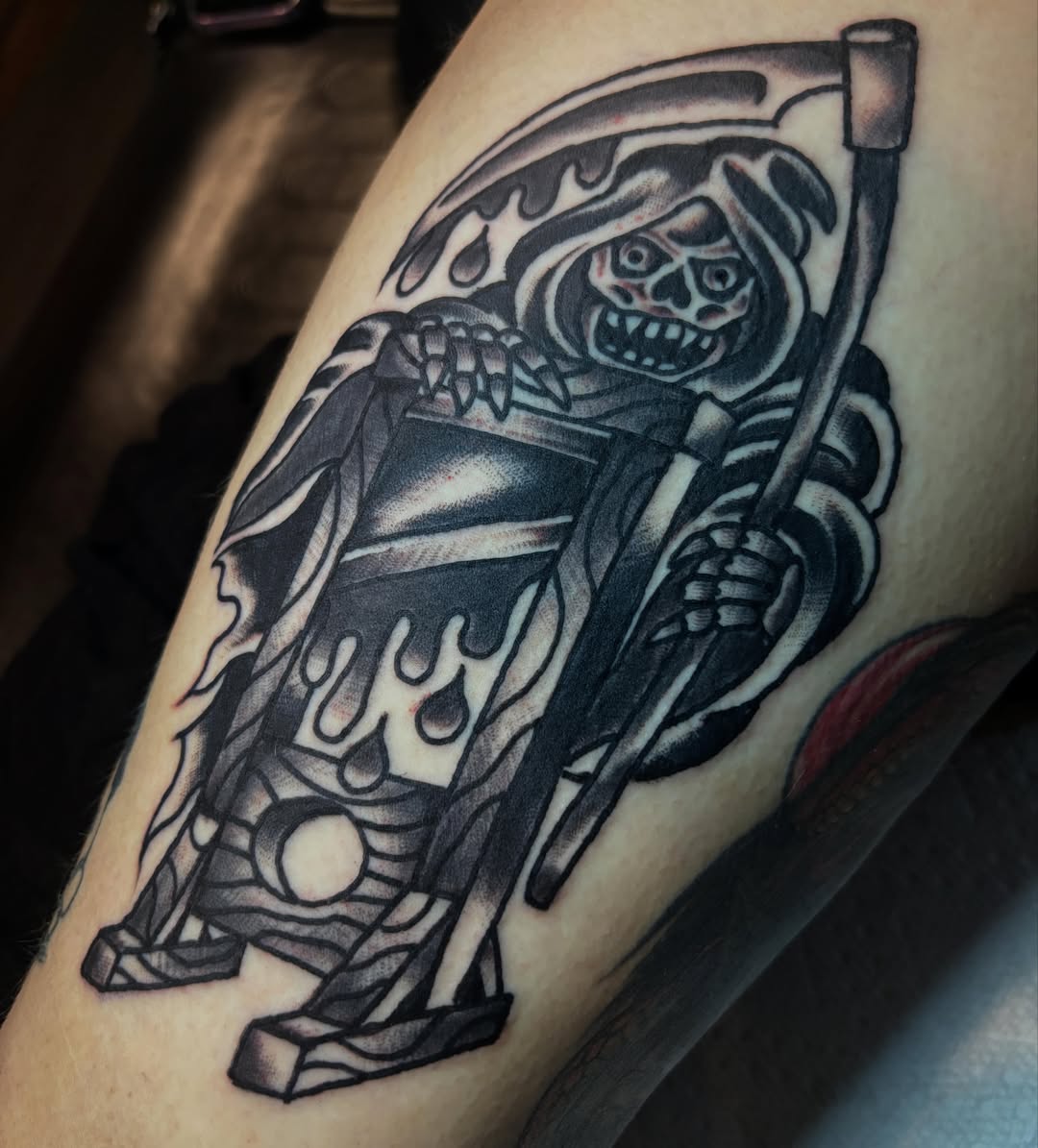 Grim reaper black and grey tattoo on the thigh by Mitch Ashpaugh