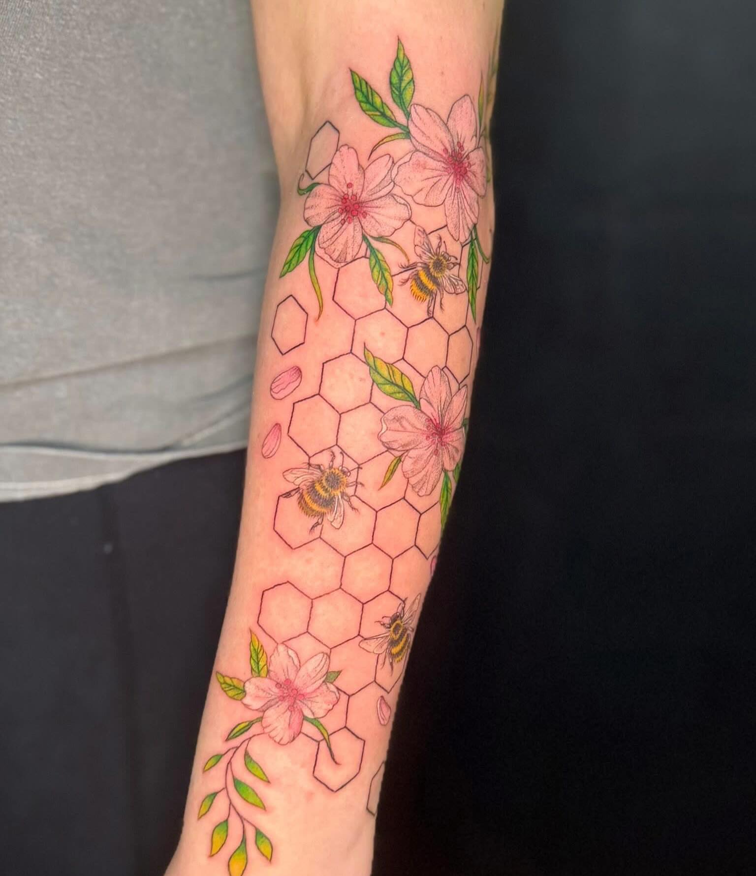 Bees and blossoms geometric tattoo on the forearm by Olivia, Royal Oak, Michigan