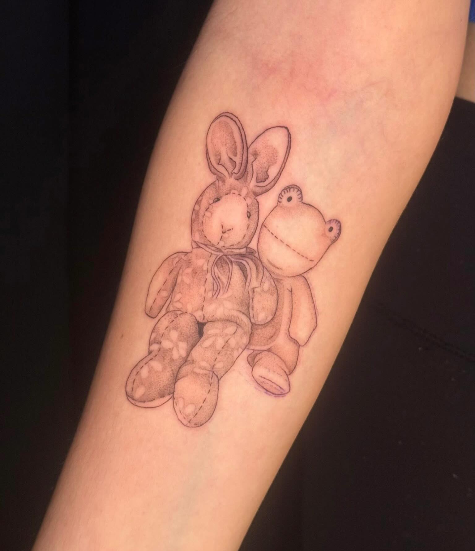 Stuffed animals black and grey tattoo on the forearm by Olivia, Royal Oak, Michigan