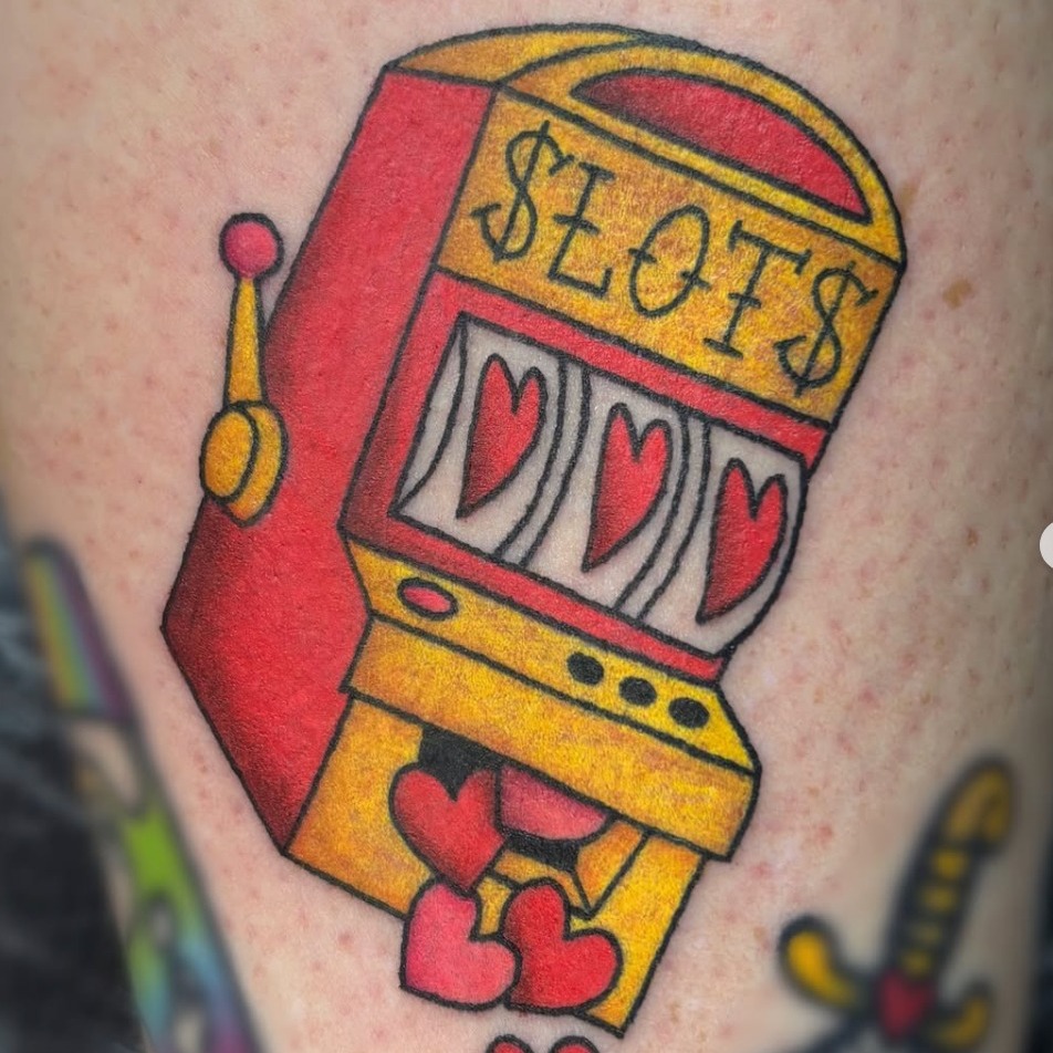 Slot machine American traditional tattoo on the forearm by Bree Burgess