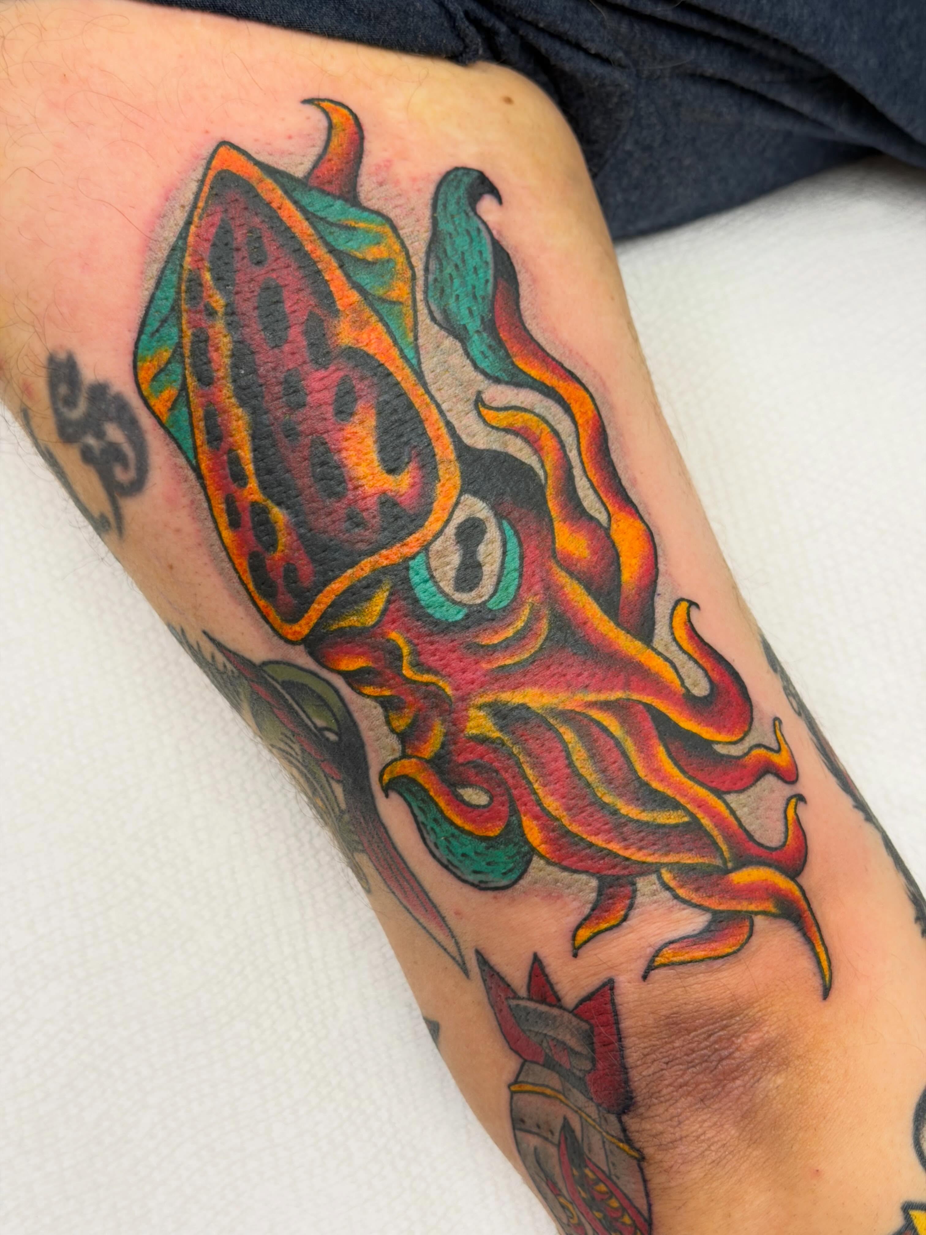 Squid American traditional tattoo on the forearm by Colbylee Tattoo Norwich