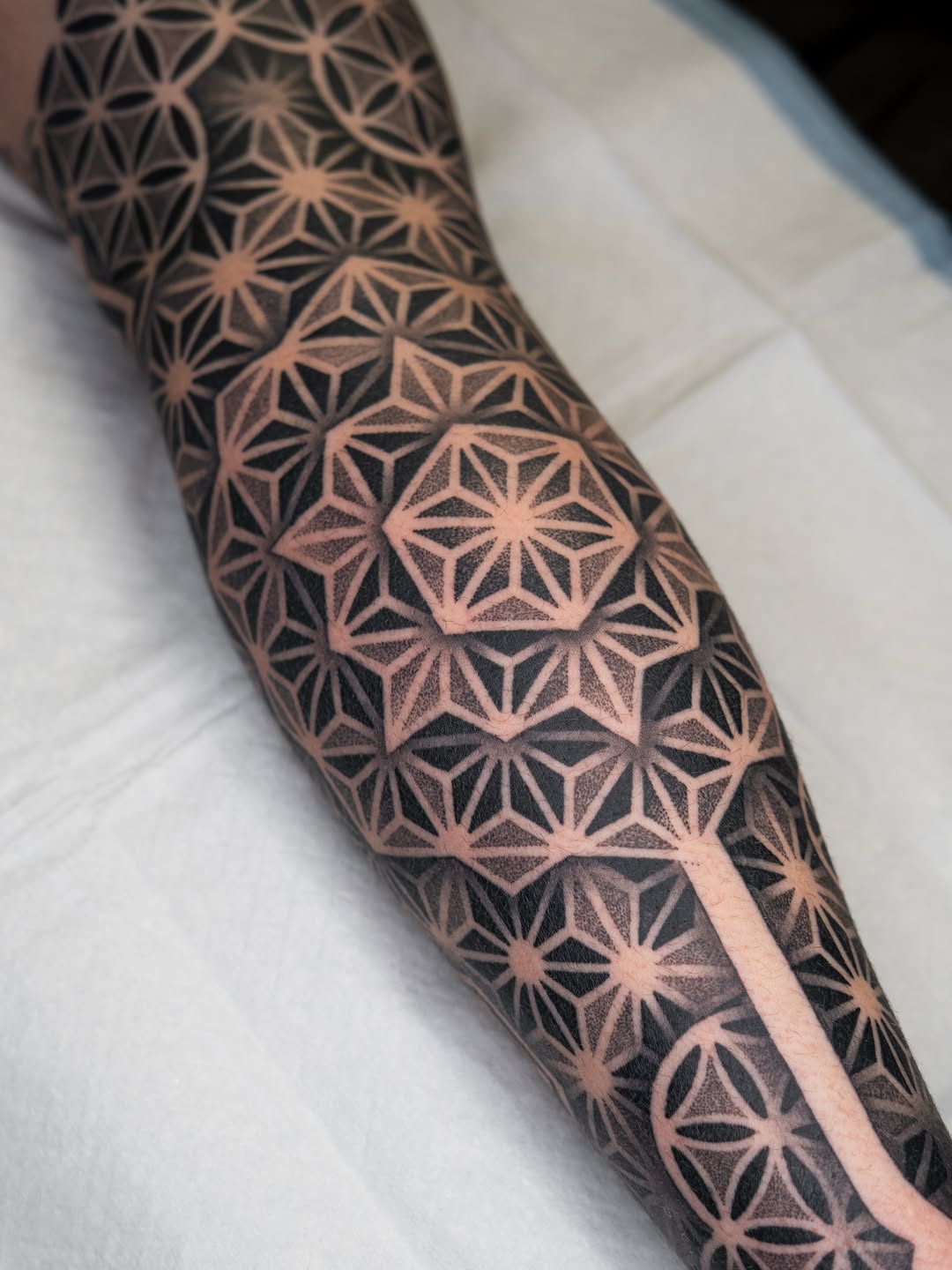 Tattoo by @rjxdots — geometric, dotwork