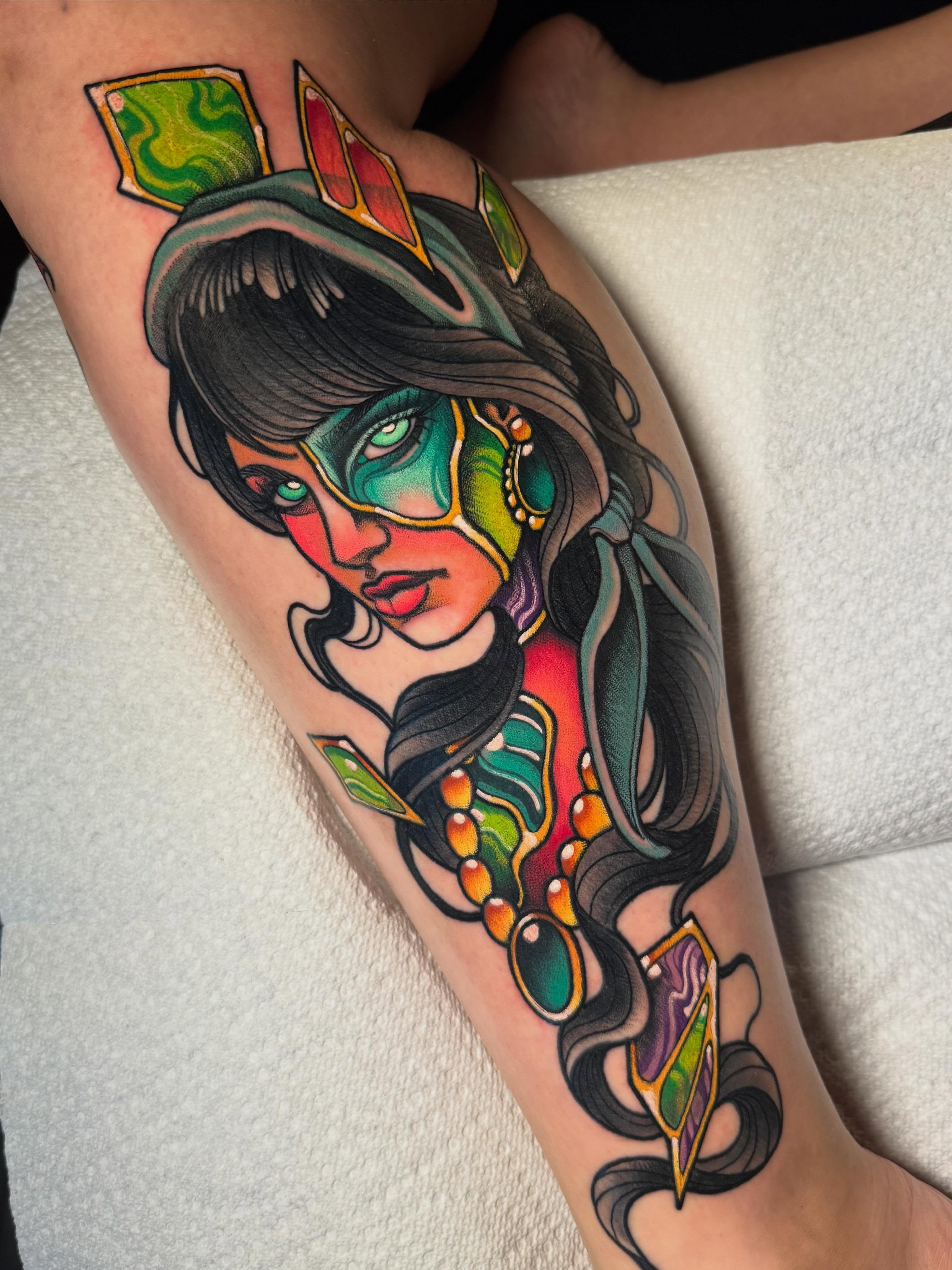 Woman with mask American traditional tattoo on the forearm by Jess Longfield, Des Moines, Iowa