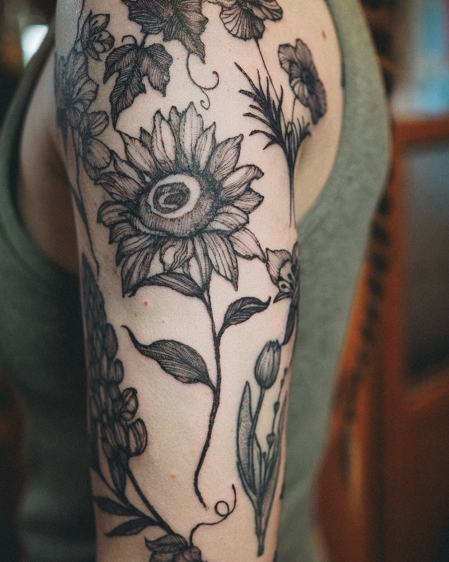 Sunflower black and grey tattoo on the forearm by Inks by Nastia